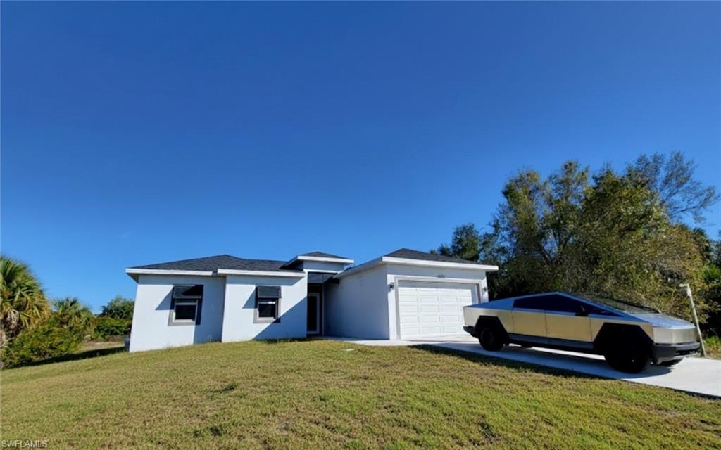 *** WATERFRONT HOME ON CANAL ***  EXTRA WIDE VIEW IN BACKYARD COMPARED TO MOST HOMES IN THE NEIGHBORHOOD !! Comes with Buyer Warranty **Stunning Modern Home with tens of thousands in upgrades**! Welcome to luxury living in this meticulously designed modern home
nestled in the heart of Buckingham Fort Myers. Step into elegance with pristine white polished floors that exude sophistication and charm
throughout the home. - **Designer Kitchen Elements:** The gourmet kitchen features beautiful quartz countertops, designer cabinetry, and
top-of-the-line appliances, creating a perfect blend of style and functionality. - **Huge covered Patio with Lights:** Entertain guests or unwind
in style on the spacious covered patio, illuminated by enchanting lights, offering a seamless indoor-outdoor living experience. - **Luxurious
Master en-suite:** Retreat to the opulent master bedroom featuring a luxurious en-suite bathroom complete with a gorgeous freestanding tub,
huge shower, and premium fixtures, providing a sanctuary of relaxation. - Enhancing both aesthetics and functionality, decorative shutters,
impact windows and doors add a touch of elegance while providing security and peace of mind. - **Prime Location:** Enjoy the convenience of
an amazing location offering easy access to amenities, shopping, dining, and entertainment options. - **Finest Materials Used:** Every detail
of this home reflects quality craftsmanship and attention to detail, with the finest materials used throughout to ensure lasting beauty and
durability. This exceptional residence offers the epitome of luxury living, combining modern elegance with comfort and convenience. Don't miss
the opportunity to make this dream home yours. This home has characteristics of a million dollar home with an amazing price!  Some photos of the furniture in this listing have been virtually rendered.