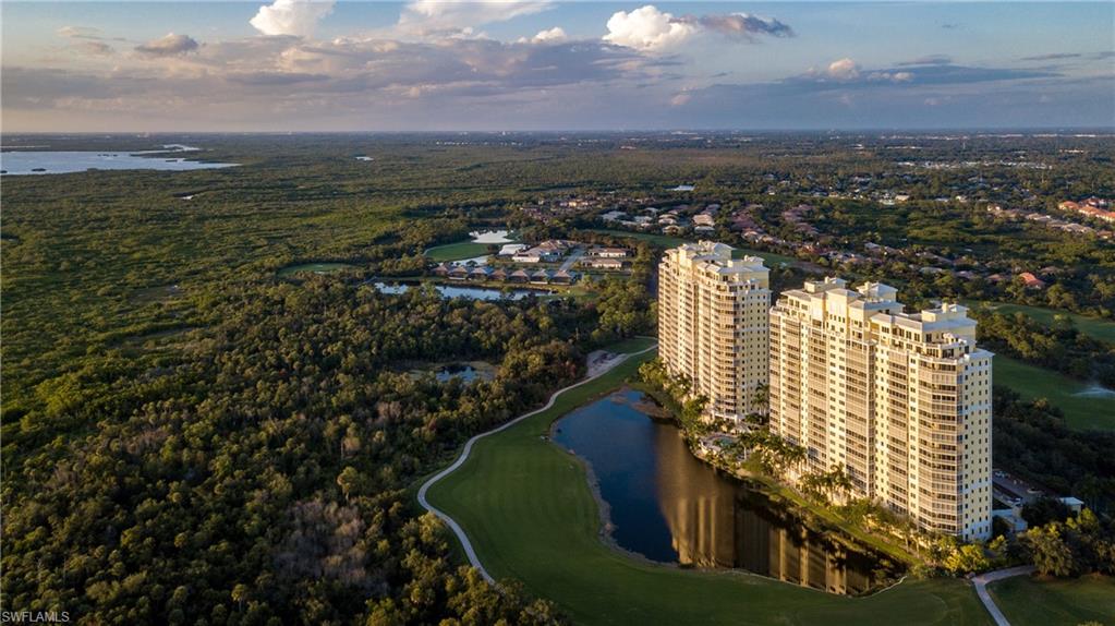 Spectacular views overlooking the golf course, Estero Bay and shimmering Gulf of Mexico! Gorgeous sunsets can be seen through the floor-to-ceiling sliding glass doors leading from the great room and master suite. Three spacious bedrooms and three-bathrooms with two private balconies on the 18th floor make this residence live large. Everything you could want in a home, gorgeous views, custom interior appointments such as marble and wood flooring, crown molding and recessed lighting. The inviting kitchen overlooks the Great Room and features raised panel wood cabinetry and granite counter tops. Enjoy stunning views of the Bay in the master bedroom suite, which offers spacious walk-in closet and a luxurious master bathroom soaking tub and dual vanities. The building amenities include a private elevator, resort club/restaurant on Bonita Beach, the Bay House w/grand pool space, restaurant, fitness center, a River Park with fishing pier, boat launch with Gulf access, playground, basketball, pickle ball, bocce and a top tennis facility. Golf membership available for the top ranked Pete Dye Championship course!
