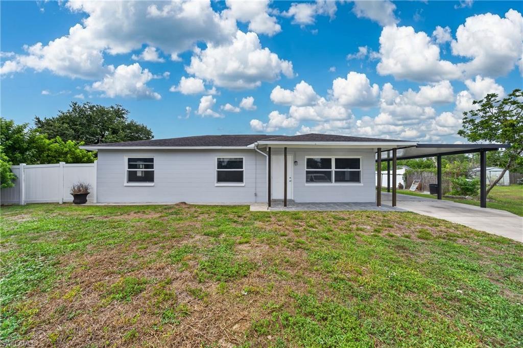 Freshly painted inside and out, this well-maintained 3-bedroom, 2-bath home is ideally situated on a quiet cul-de-sac in Lehigh Acres. Set on an oversized fenced lot with fruit trees, the property offers plenty of outdoor space for pets, gardening, entertaining, or simply enjoying the Florida lifestyle.

Inside, you’ll find a comfortable layout along with new impact windows installed in the living room and bedrooms in 2022 for added peace of mind and energy efficiency. Step outside to the oversized covered lanai, perfect for relaxing year-round, while the 10’ x 12’ storage shed provides ample room for tools, equipment, and hobbies. A covered carport adds convenience and protection from the elements.

Located just one block off Joel Boulevard, this home offers easy access to shopping, dining, parks, schools, and houses of worship while maintaining the privacy and tranquility of a cul-de-sac setting. Connected to city water and move-in ready, this property is an excellent opportunity for first-time buyers, retirees, or investors alike. Don’t miss your chance to own this affordable Southwest Florida home with room to spread out and enjoy.