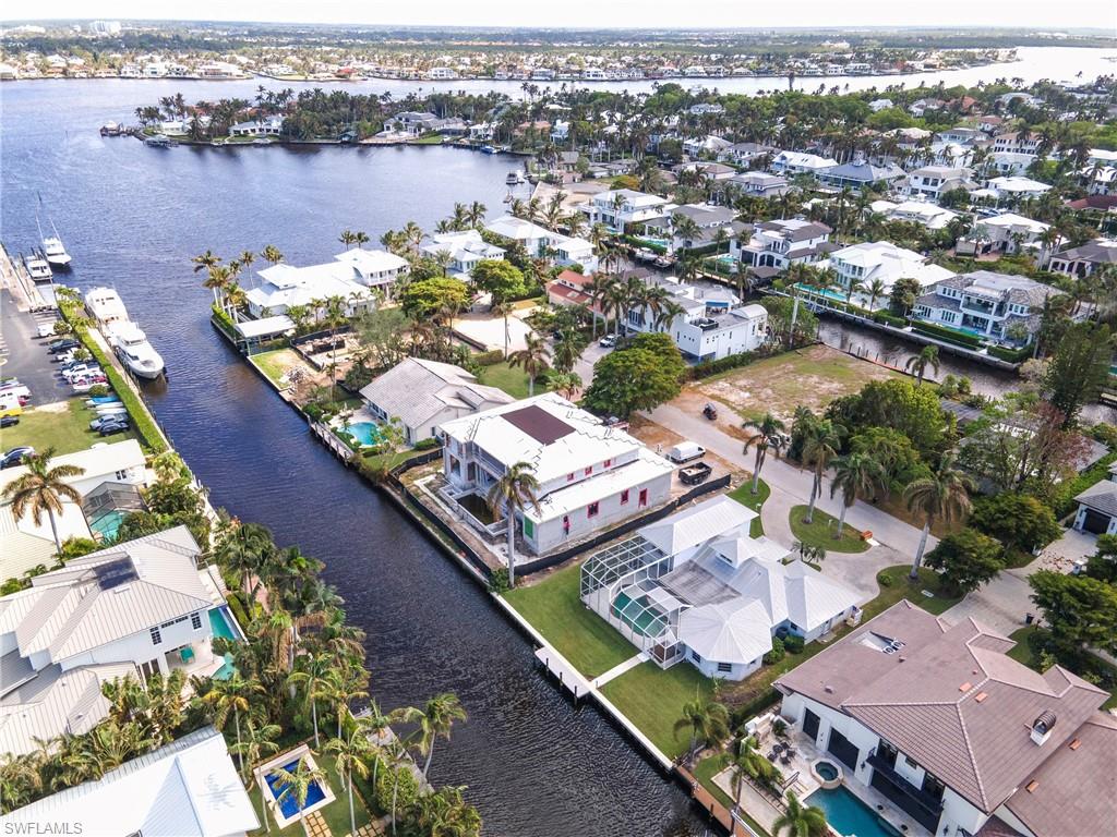 Discover an incredible opportunity in the prestigious Aqualane Shores neighborhood with 601 15th Avenue South in Naples, Florida! Located in one of Naples’ most coveted waterfront communities, this property offers direct access to Naples Bay, making it a boater’s paradise with the Gulf of Mexico just moments away. Imagine building your dream single-family home here, surrounded by lush landscapes, sparkling waterways, and luxurious homes. Aqualane Shores is known for its serene, tree-lined streets and exclusive charm, offering the perfect blend of privacy and proximity to Naples’ finest amenities. Enjoy being just a short stroll from the vibrant dining, shopping, and cultural experiences of Third Street South and Fifth Avenue South. Plus, with nearby world-class golf courses, the internationally renowned Naples Pickleball Center, Baker Park and the Greenway, this location is ideal for those seeking an active yet relaxed lifestyle in the heart of Naples. Embrace the ultimate in coastal living and make this Aqualane Shores property the canvas for your custom Naples retreat!