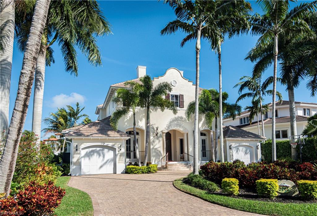 Indulge in luxurious resort style living, on the serene side of Royal Harbor.  Take pleasure in the peaceful, "wide water" Bay views of Haldeman Creek.  Multiple balconies allow you to enjoy observing the myriad of wildlife that jump, dive, swim, and fly through this tranquil, natural preserve enveloped area.  This elegant home has a timeless beauty, reminiscent of a tropical, Mission Revival style architecture. It will feel like an "endless weekend" as you delight in the inviting outdoor entertainment area with alfresco kitchen, rock waterfall spa, and glistening disappearing edge pool.  Further amenities offered are a private elevator, lavish master suite that includes a wet bar, dual laundry rooms, formal and informal spaces for entertaining, billiard/flex room (that can be converted to fourth bedroom), and an inviting, open kitchen, that will surely be the heart of many festive gatherings.  The direct Gulf access with boat dock and lift will undoubtedly appeal to leisure boaters, while the close proximity to downtown Olde Naples will entice those attracted to all the best things, that Naples has to offer. Luxury, location, and unsurpassed living.
