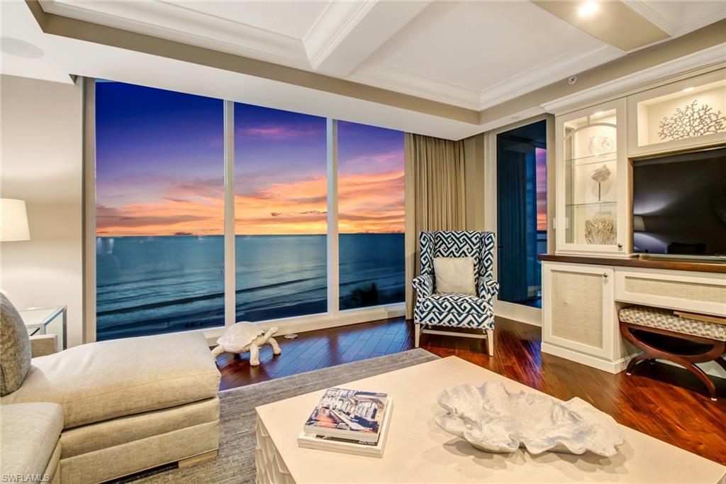 Breathtaking views await from this highly sought after and rarely available front-facing Panorama unit. Ideally positioned on the Northwest corner of Moraya Bay, floor to ceiling windows frame the beautiful curves and sparkling lights along the coast to Sanibel. Purchased from the builder in 2014, the decorator ready buildout was designed by Barbara Greco of Barbara Hyman Interiors.  The elegant, coastal design has extensive built-ins and upgrades that blend tech and style seamlessly, including a designated guest wing with study area & re-imagined ADA compliant master bath with Gulf views and custom owner’s closet. Each unit enjoys a private lobby entrance from the elevator and impressive views from every window. Entertaining is made easy with a chef’s kitchen, featuring Monogram appliances and butlers pantry. Moraya Bay is an amenity rich and pet-friendly building directly on Vanderbilt Beach and features Five-Star luxuries such as: Access to The Floridian Beach Club and Kalea Bay, gated entry and attended lobby, 2 resort pools, chair and towel service, private restaurant with pool and beachside service, impressive fitness center, concierge, and 24/7 security. *3D TOUR AVAILABLE*