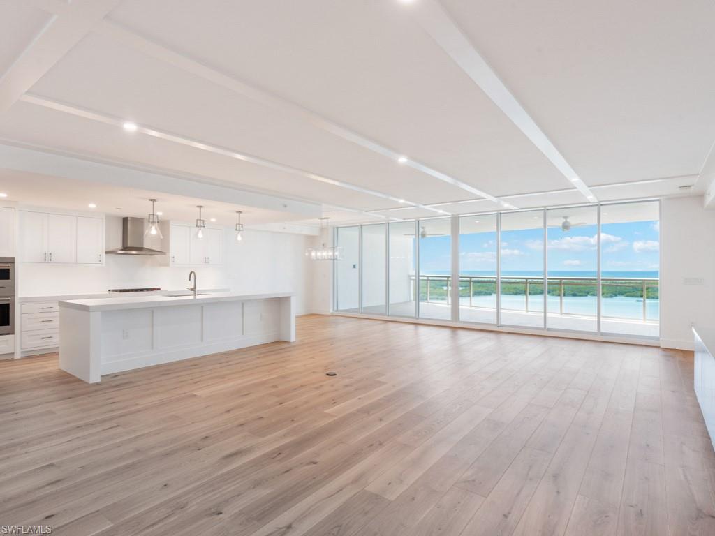 Enjoy spectacular sunsets and 5-star resort lifestyle living at this BRAND NEW NEVER LIVED IN AND MOVE IN READY - four bedroom, four full bath luxury residence at Kalea Bay. Expansive floor-to-ceiling windows provide stunning panoramic views of the Gulf of Mexico and Turkey Bay. The private elevator delivers you to the neutral space with white kitchen ready for your personal touch. Beautiful Legno Bastone wood floors, gourmet kitchen with Wolf and Sub-Zero appliances, quartz  island, butler’s pantry with custom cabinetry and Sub-Zero wine refrigerator, are just some of the many upgrades. Wake up to gorgeous views of Turkey Bay and the Gulf of Mexico from the master suite with floor to ceiling windows. En-suite baths and walk-in closets with custom built-ins complete this luxury space. Enjoy the rooftop pool, social room, gas grills and open-air fitness. The Kalea Bay Club offers five-star resort amenities, wellness center, three pools, restaurants, pickleball, tennis, kids game room and overnight cottages for guests. Don’t miss this opportunity to own a NEW sensational property in one of Naples' most prestigious resort style communities. More Photos coming soon!