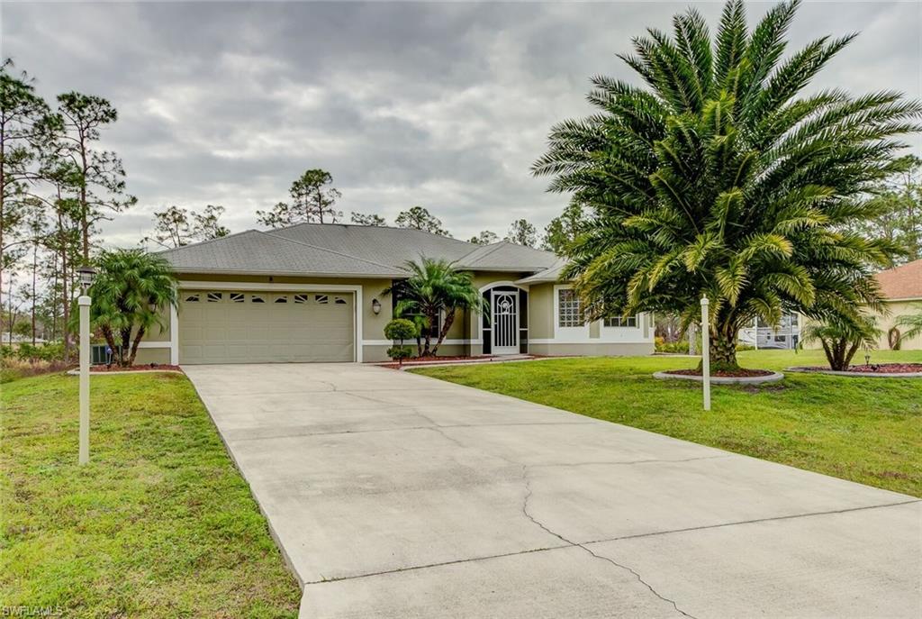 Won't Last Long! This home is Move-in ready and in Immaculate condition on 1/2 ACRE. Property features 3 bedrooms, 2 full baths, formal living and dining area, separate family room with breakfast nook, GRANITE COUNTERTOPS in the kitchen, stainless steel appliances, , tile throughout with woodlike flooring in all bedrooms, His and her walk-in closets, dual sinks and separate tub and shower in the master suite, Cathedral Ceilings,  auto sprinkler system, oversized screened-in lanai completely tiled, 2 newly installed fans to convey, front porch also screened in.. Schedule a showing today!!