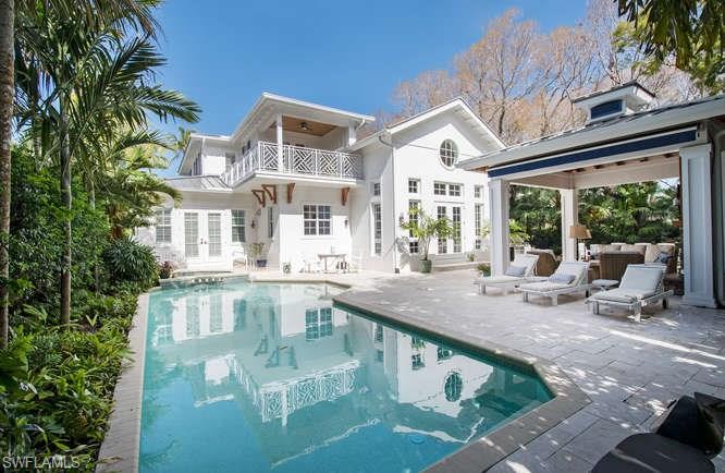 Spectacular four bedroom, plus den two story home with a thoughtful and efficient use of space. Ideally situated, nestled just blocks from the celebrated beaches of Naples, Florida and within a short distance of the internationally recognized cultural district of "Fifth Avenue South."  The unique downtown location features an expansive garden area featuring a pool, spa and large outdoor cabana with a gas fire place. The large first floor master suite has a generous walk-in closet and a luxurious master bathroom with bathtub, dual sinks and spacious shower. The open floor plan and large outdoor areas are perfect for entertaining. The well-planned kitchen includes a large island that leads out to a multi-functional great room with soaring ceilings and walnut flooring. This highly sought after and rarely available single family home with bright and beautiful views from every room will certainly impress. This offering represents a rare opportunity to enjoy the best Old Naples has to offer.