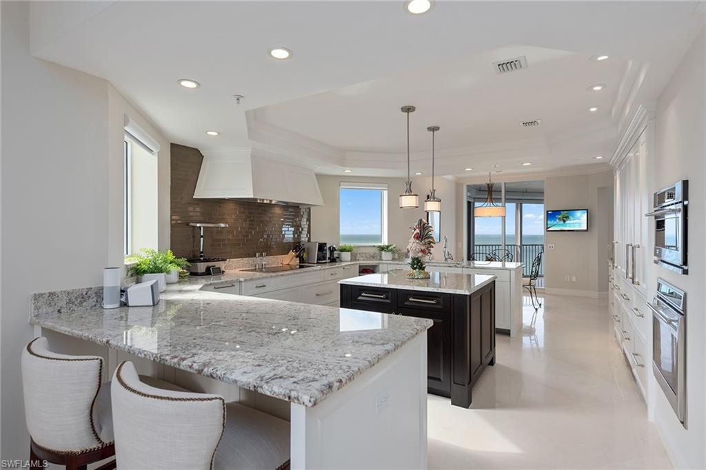 Gorgeous Gulf and Sky views! This bright & light high floor 01 floor plan sits directly on the beach in the private gated community of Bay Colony in Pelican Bay. Featuring unobstructed panoramic views of the Gulf of Mexico through floor-to-ceiling glass sliders off of the main living area, separate breakfast area and master bedroom. This is a highly sought after design which welcomes you into an elegant entry foyer and spacious living area boasting polished marble floors, elegant moldings, lighting & trim and a separate dining area. The open chef’s kitchen and den area offer plenty of room for entertaining family and guests including 2 full guest bedrooms, both with en suite baths. Extra additional storage at garage level. The Biltmore amenities include an impeccably renovated lobby with 24-hour manned front desk, two guest suites, fitness center, social rooms, and a resort-style pool. Bay Colony residents enjoy the use of their own private newly renovated beach club and restaurant, a tennis club, as well as the use of the amenities of Pelican Bay. Private golf memberships are available separately. The Biltmore makes a perfect home for an unsurpassed Naples lifestyle!