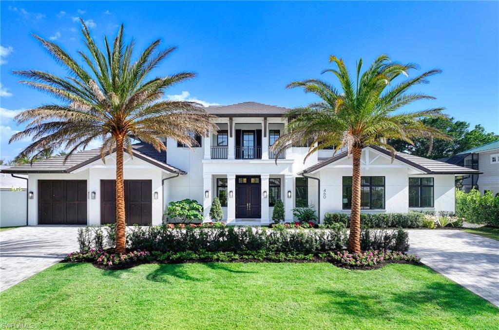 Situated on one of the most prestigious streets in Naples, just moments from its world-renowned sugar sand beaches, this exceptional new construction residence is set on an oversized homesite in the highly desirable X and X500 flood zones allowing for seamless 1st floor living. The home offers five ensuite bedrooms, including a ground-level owner's suite with a spacious dressing room, study, and a flex room that offers a versatile space, perfect for a home gym, second closet, den or art studio. At the heart of the home is a magnificent great room, where timeless sophistication meets modern innovation. The residence includes a formal dining room, a state-of-the-art kitchen, and the latest in home automation, security, and built-in audio with speakers. The chef’s kitchen features high-end appliances from SubZero, Miele, and Wolf, dual wall ovens, beverage drawers, and a quartzite-topped island. A separate service kitchen with walk in pantry, a built-in Miele coffee maker, an additional dishwasher, and a second SubZero refrigerator makes hosting effortless. The dining room’s beverage center is complete with a climate-controlled SubZero wine chiller and refrigerator drawers. The additional bonus room upstairs serves as a flexible second living area with a breakfast bar, sun deck, and balcony, offering additional spaces to relax and take in the views. The home is fully equipped with modern conveniences, including a private elevator and home generator. Outside, the resort-style pool is surrounded by manicured green space and expansive outdoor living areas, including a dedicated alfresco dining space, perfect for gatherings under the stars. The elevated homesite provides a rare combination of an expansive yard and a grand pool, a unique feature in Naples. For the automobile enthusiast, the home boasts a spacious four-car garage, with two front bays, a two car rear bay, and the capacity to accommodate car lifts for additional storage. Designed at an optimal elevation, the garage allows for effortless access into the home without the need for multiple steps, ensuring both convenience and functionality. Completed with concrete block construction, concrete stairs, and a concrete second level, this residence is crafted to the highest Florida building standards, ensuring durability and longevity. This remarkable home, designed by esteemed architect Falconer Jones and built by GWB Custom Homes, presents a rare opportunity to bypass years of planning and construction, offering the immediate chance to own a masterpiece of craftsmanship and prestige in the heart of Naples. A sanctuary of elegance, innovation, and effortless luxury. A must-see.