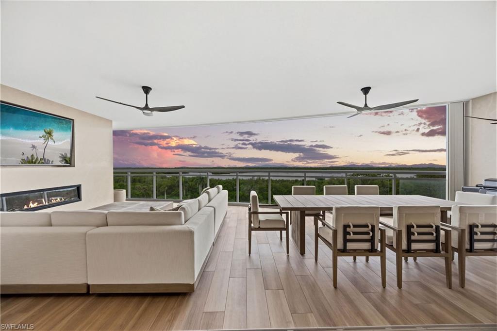 Introducing one of the most extraordinary and extensively customized residences ever offered in Kalea Bay. Perfectly positioned in the community's newest luxury tower, this exceptional turnkey residence captures sweeping western-facing views across the preserve, bay, and Gulf, delivering spectacular sunsets and an unmatched coastal lifestyle. Meticulously redesigned far beyond builder specifications, every detail reflects superior craftsmanship, timeless design, and luxury living at its finest. Designer-selected finishes, custom millwork, sophisticated textures, and curated lighting create an atmosphere more reminiscent of a luxury penthouse than a traditional condominium. The chef's kitchen serves as the centerpiece of the home, featuring custom cabinetry, premium Cambria quartz countertops, integrated Galley workstation sinks, an expanded pantry, built-in wine refrigeration, and a state-of-the-art TopBrewer coffee and sparkling water system valued at over $25,000. The open-concept design flows seamlessly into the spacious living and dining areas while maximizing the spectacular water views from nearly every room. The luxurious primary suite offers a completely reimagined spa-inspired bath featuring custom cabinetry, Cambria quartz surfaces, Waterworks sinks and fixtures, designer brass accents, custom shower hardware, illuminated Seura LED mirrors, and a fully customized closet system. Guest suites are equally impressive with custom closets and beautifully appointed ensuite baths finished to the same exceptional standard. The expansive lanai functions as a true outdoor living room with a dramatic stone feature wall, fireplace, integrated entertainment, and panoramic views stretching across the preserve, bay, and Gulf. Additional upgrades include a custom living room built-in with stone detailing and fireplace, RH hardware and lighting throughout, Lutron automated shades, integrated televisions, hurricane shutters, and extensive custom storage solutions. Offered turnkey, this remarkable residence includes a curated collection of designer furnishings, décor, artwork, accessories, and linens, creating a truly move-in-ready opportunity. Kalea Bay offers one of Naples' most amenity-rich lifestyles centered around a spectacular 100,000-square-foot resort amenity campus featuring multiple pools, an adult-only pool, two restaurants, a 14,000-square-foot wellness center and spa, yoga and Pilates studios, tennis and pickleball courts, rooftop terraces with infinity-edge pools and sky lounges, grilling areas, outdoor fire pits, luxury guest suites and cottages, and a private beach shuttle to the Gulf. Luxury, sophistication, world-class amenities, and breathtaking waterfront views combine to create a rare opportunity to own one of the finest residences in Kalea Bay. One or more photos have been virtually staged, AI-generated, or rendered. (Furniture package available separately. Please refer to Confidential Remarks for details.)
