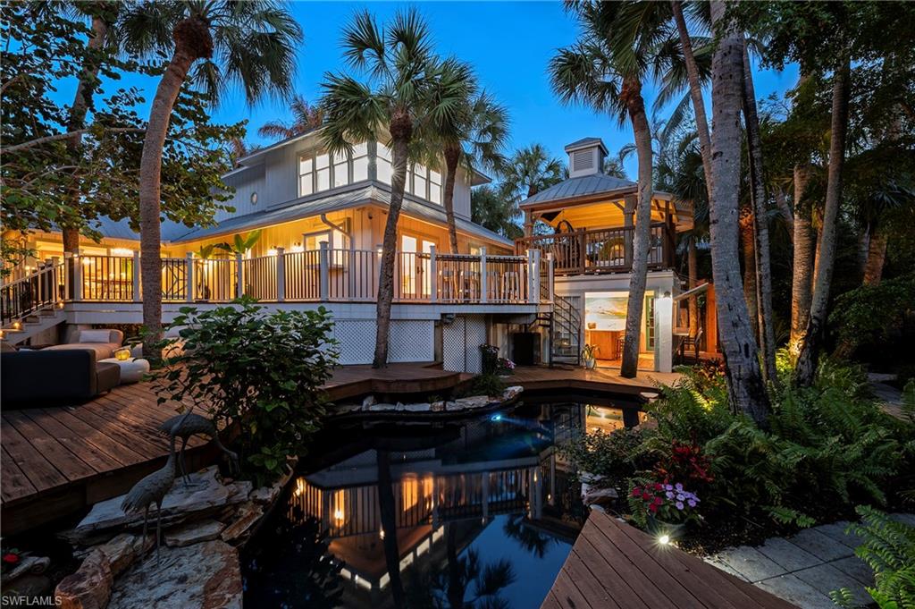 PRICED AT LAND VALUE! LOWEST PRICED LISTING ON THE BEACH BLOCK IN ALL OF OLDE NAPLES — (Optional 50’ boat slip at the Cove Inn available for purchase with the property.) Opportunity knocks for a chance to own the ultimate beach cottage in one of Naples’ most coveted locations, just steps from the iconic Naples Pier and the white sugar-sand beaches of the Gulf. Privately tucked within lush tropical landscaping, this one-of-a-kind “Swiss-Family Robinson Treehouse” blends artistic charm with modern comforts, creating a secluded retreat in the heart of Olde Naples. Just a short stroll from the boutiques, fine dining, farmers markets, local parades and vibrant coastal lifestyle of 3rd Street South, the setting simply cannot be replicated. Designed for both relaxation and entertaining, the property showcases an incredible collection of unique indoor and outdoor spaces, including a heated swimming pool, private courtyard oasis, detached bar house with full kitchen, tranquil koi pond, infrared sauna, outdoor shower, and a raised covered “widow’s watch” seating area perfect for enjoying Naples sunsets, firework shows and coastal breezes. Additional highlights include a durable metal roof, back-alley access, oversized driveway for 5+ vehicles, and exceptional privacy throughout the property. Situated on a 77’ x 151’ lot, the possibilities are endless. Whether you envision renovating and enjoying the existing residence, creating a luxury custom estate, or developing a high-end investment property, this homesite offers extraordinary potential in a premier beach-block location right in the action of downtown Naples. Investors will appreciate the strong vacation rental and spec-home opportunities, while end users can create the ultimate private beach retreat just a few steps from the Gulf of Mexico. Adding to the long-term appeal, the newly reimagined Naples Pier is nearing completion, further enhancing the value and desirability of this exceptional location. A rare offering with unmatched character, location, and future potential — this is Olde Naples living at its finest. High and dry with no flooding waters entering the main residence.