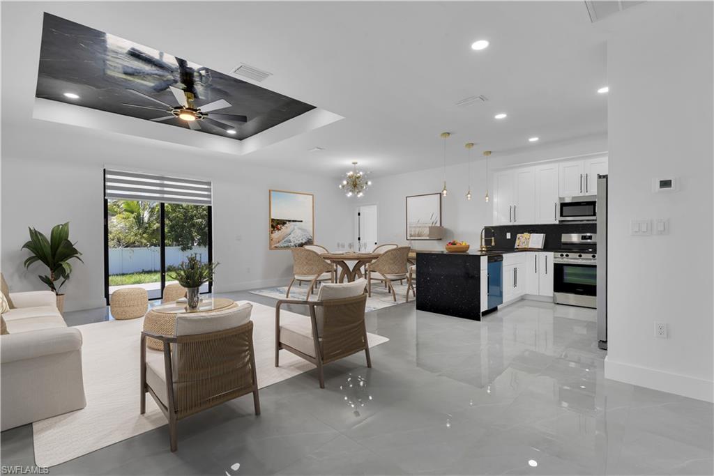 Exquisite Living Experience and Helping with Buyer's Closing Costs! Come to enjoy our featured listing of the month. This trophy single-family residence offers a very spacious layout with modern and breathtaking upgrades. It is a 3 bedroom 2 bathroom and 2 car garage and large extended back porch, one story home centrally located in one of the best areas in Lehigh Acres. Among many more novel attributes, this home offers a spacious gourmet kitchen with LED Raindrop Pendant Lighting and a dining room with a modern 8 Lighting golden Chandelier. Two shower bathrooms exhibiting black and brushed golden vanity faucets, LED bathroom antifog dimmable memory lighted mirrors, shower niche golden framed, and hand shower wall mounted. Its soaringly designed Resina Epoxy and recessed LED lighting living room ceiling is a masterpiece, marvelous black galaxy polished granite kitchen and bathroom countertops, and 5 inches luxury baseboards. Flooring 24 x 24 porcelain tile all around the house, additional laundry/folding room with extra cabinetry, and black/golden handles. The kitchen features a faucet w/pull-down sprayer, a steel dual sink, stainless steel appliances, and much more... There are 4 more locations available in SW LEHIGH ACRES 33976 with the same layout and ready to move!!