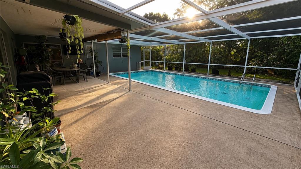 One or more photo(s) has been virtually staged, AI generated or rendered.  Welcome to this beautifully maintained 4-bedroom, 2-bath pool home in the established Natoma Park neighborhood of Fort Myers. Featuring a brand-new roof installed in 2025, this move-in-ready home offers added value and peace of mind. The beautifully updated kitchen boasts modern finishes, ample cabinetry, and generous workspace, while the spacious living areas open to a screened lanai and private pool, perfect for relaxing or entertaining year-round. With public water and sewer, no mandatory HOA, and a prime location just minutes from Fort Myers Beach, Sanibel Island, shopping, dining, and HealthPark Medical Center, this home offers the best of Southwest Florida living.