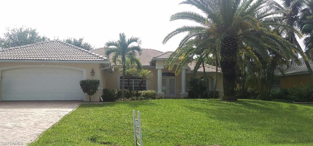 Prestigious Rose Garden location!!! Minutes to Tarpon Point Marina! Located across from high end waterfront homes, this meticulously maintained 3 bedroom, 2 bath pool home shows like a model. This home is loaded with upgrades!  Tile in main living area, master bedroom has two sets of sliding doors to the lanai and pool area. The great room has 18 feet of sliders that open up to a spacious lanai great for entertaining, along with a heated pool, spa and mature landscaping to highlight this beautiful home. ONE YEAR HOME WARRANTY INCLUDED!!