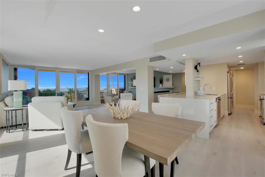Simplify your life! This masterpiece is a designer furnished special that gives you the perfect combination of white sand beaches, coastal luxury styling AND unbelievable sunsets. Overlooking the sand and blue waters of the gulf give a distinct feel of vacation but with the comforts of a home! Enjoy this completely transformed condo with fine wood floors, quartz counter tops, custom closets and your own washer and dryer.  Live the BEST that Naples has to offer with beachfront living and walking distance to Venetian Village.  Find your home in paradise here on the Naples Coastline.