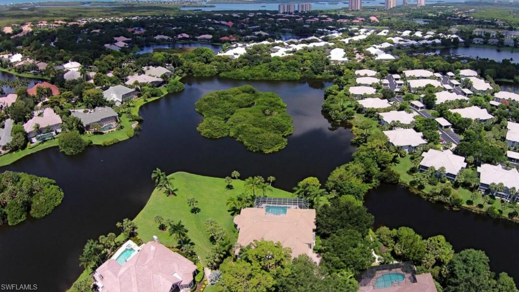Phenomenal lake views define & surround this beautiful & newly designed 4 bed, 5 bath pool home. A gorgeous & oversized cul-de-sac lot showcases a reservoir of lush tropical landscaping as well as an abundance of rear lawn space ideal for children or pets at play. A beautifully open foyer generously gives way to a formal living room where breathtaking lake views capture the eye & fully pocketing sliding glass doors bring the outdoor living space in. Exquisitely designed w/magnificent upgrades including travertine marble, wide-panel dark wood floors, electric fireplace, transom windows, custom fans & lighting, & so much more. One-of-a-kind marble granite take center stage in a stunning & open kitchen that will easily become the Chef’s delight w/stainless steel appliances, induction cooktop, double oven, & custom wood cabinetry. The master suite & ensuite guest rooms alike afford every luxury one would expect after a day on the golf course or beach, w/granite counters, travertine marble floors, wood cabinetry, & a wealth of closet space. An ideal home for entertaining w/ desirable Southwestern exposure to capture the majesty of every sunset & the essence of Southwest Florida living.