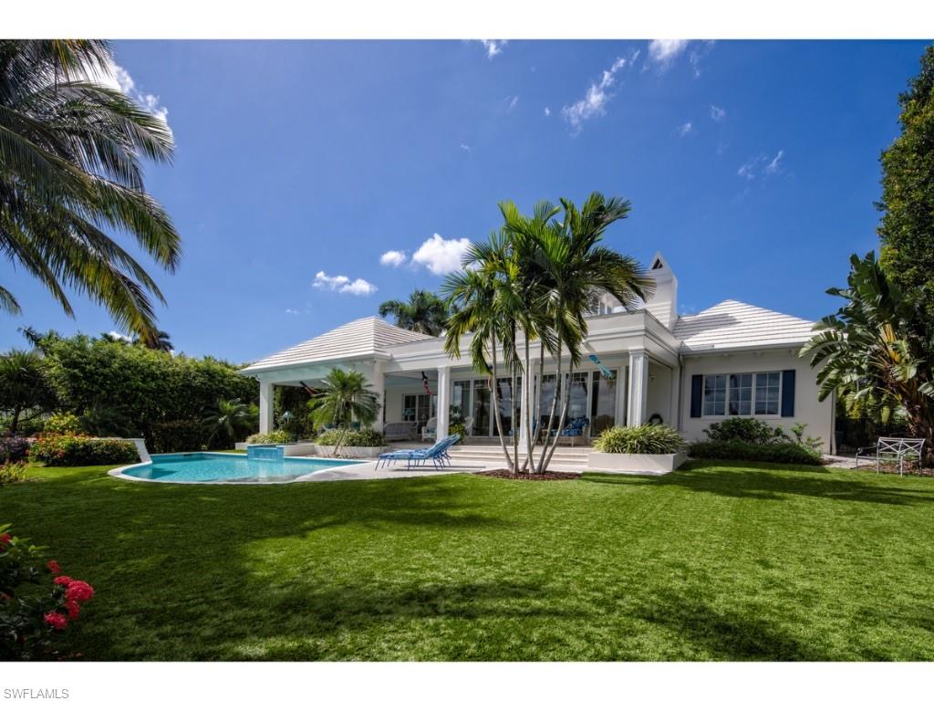 Remarkable views of Naples Bay! The exceptionally deep property offers privacy and solitude with a dramatic, densely vegetated approach from Galleon Drive. The home, abundant with natural light, was designed by Herscoe Hajjar Architects, LLC, to take full advantage of the wide water vistas. The dramatic great room, featuring “Accordion style doors” along the water-side of the room, opens to the rear terrace and outdoor living area and serves as the nucleus of the home. The residence features 5 bedrooms, a study, and plenty of storage. 3-car garage. The large covered outdoor living area overlooks the pool, spa, and spacious back yard with bountiful green space for yard games and enjoying the Naples waterfront lifestyle. Easy no bridge access from the dock to the Gulf of Mexico and estuarine waterways. Port Royal Club membership eligibility.