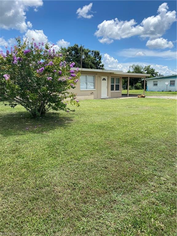 Adorable home waiting for a new family. This home has been remolded inside, has granite counters, maple cabinets, tile floor throughout and has been freshly painted inside and out.  Roof was new in 2013 as was the AC. Hot water heater is a few years old. All new plumbing to the city sewer installed 3 years ago. 
 There is a large shed at the end of the carport with electricity and possible water. There is a slop sink outside in the carport as well, nice for when you're working on your lawn or car and can wash up before going inside.  The 3 season room has windows all around and can be closed off from the main house.
Priced to sell!!