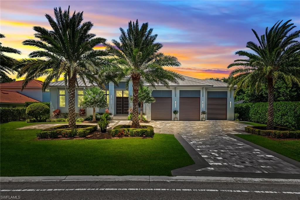 Nestled in the prestigious Park Shore community, 4651 Crayton Road is a masterfully designed coastal retreat that seamlessly blends elegance, comfort, and modern sophistication. This expansive residence offers four bedrooms plus a den, four full baths, and two half baths, providing an unparalleled setting for refined living and effortless entertaining. Ideally situated west of US-41, this home places you just moments from the white sands of Seagate Beach and within easy reach of Venetian Village and Waterside Shops—Naples’ premier destinations for upscale dining and boutique shopping. Optional private beach access through the Park Shore Association further enhances the coastal lifestyle. Designed for the discerning chef, the gourmet kitchen is a showpiece, boasting top-tier Wolf & SubZero appliances, a gas range, and an oversized double island—perfect for intimate gatherings or grand entertaining. The luxurious flow continues into the expansive lanai, where a resort-style pool, outdoor kitchen, and lush tropical landscaping create a serene, private sanctuary. Motorized bug screens and hurricane shutters provide additional comfort and security, ensuring year-round enjoyment of the outdoor spaces. Inside, state-of-the-art amenities elevate this home’s appeal, including a theater room, whole-home AV and smart automation, and a private CAR LIFT in the garage, ideal for collectors or maximizing storage. From bespoke finishes to the seamless indoor-outdoor connection, every detail has been thoughtfully curated to enhance your living experience. 4651 Crayton Road is more than a home—it’s a lifestyle. Experience the best of Naples living in one of its most sought-after neighborhoods.