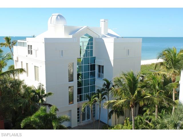 Gulf front  4 story home offers features not found in any Naples area home regardless of price & 10' glass doors to 50' high glass foyer, glass atrium elev w/fiber optic lighting, lg gym area on the gulf w/juice bar & full ba w/lockers, a vintage ice cream parlor, a real 59 pink caddy convertible bar, diner, sports theater w/3-50" & 1-60" TVS,  pool table, slot machines, grt rm w/2 walls of glass, granite fp, open/covered decks, gulf dining rm w/builtins, dream kitchen,  eat-in, grilling deck, 4 or 5 bdr, 6 & 1/2 ba, ma bdr inc deck w/spa, office, star closet, ma ba w/his & her areas, movie theater,  4th flr on the gulf bonus rm & deck,  2nd kitchen off priv suite/play area, sunroom/greenhouse, 360 degree observatory w/computerized telesope, granite & wood floors, 14 flt screens & 2 proj syst,  onetouch lighting, impact sliders & elec shutters, 45KW Gen, 3 car gar(lift), park for 8, beach garden pool/spa, boat dock sep purchase.