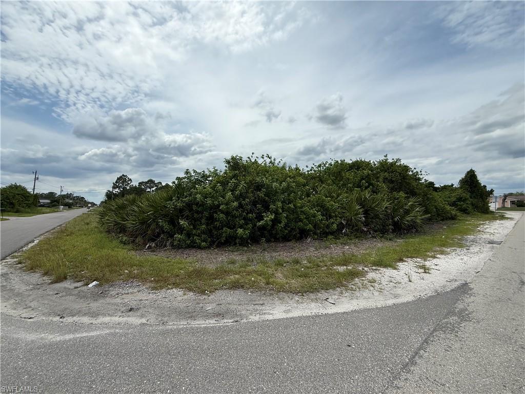 Build your dream home on this exceptional corner lot located in the heart of Lehigh Acres, one of Southwest Florida's fastest-growing communities! Positioned on a paved road within an established neighborhood, this desirable homesite offers added flexibility for your future home design, enhanced curb appeal, and convenient access from multiple streets.

Enjoy a central location just minutes from shopping, restaurants, schools, parks, and everyday conveniences. With quick access to SR-82 and I-75, commuting to Fort Myers, Southwest Florida International Airport, and the Gulf Coast's world-famous beaches is easy and convenient.

Overhead electric service is available along the street, though no utilities are currently connected on-site. Whether you're ready to build now or looking for a smart investment opportunity, this corner lot offers outstanding value in a thriving area experiencing continued residential and commercial growth.

Don't miss your chance to own a prime piece of Southwest Florida real estate and secure your place in the future of Lehigh Acres!