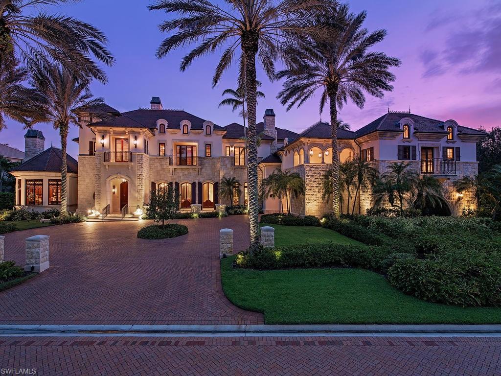 H.16296 - A palatial home ideally positioned with forever views of sunset skies and the manicured ninth fairway of the prestigious Bay Colony Golf Course. Elegantly appointed with the highest level of finishes and fixtures throughout, this thoughtful masterpiece exudes a rich European aesthetic with Venetian plaster, exquisite millwork, barrel-vaulted ceilings and inspired architectural details. Truly, an estate of this magnitude is the very definition of Grandeur: "Splendor and Impressiveness, Especially of Appearance and Style". Beyond the gallery foyer, there are many additional gathering areas for entertaining. A grand-sized gourmet kitchen w/ commercial grade appliances opens to a light filled morning room overlooking the magnificent resort style pool and water features, and there is a gracious room for formal dining, a large family room, billiards/game room with a stately mahogany bar and a handsome study with elaborate millwork. The master suite is pure opulence, with a sumptuous bedroom and separate his and her bathrooms befitting of royalty.  Two enormous walk-in closets. There are also five spacious guest bedrooms with en-suite baths, plus staff quarters.