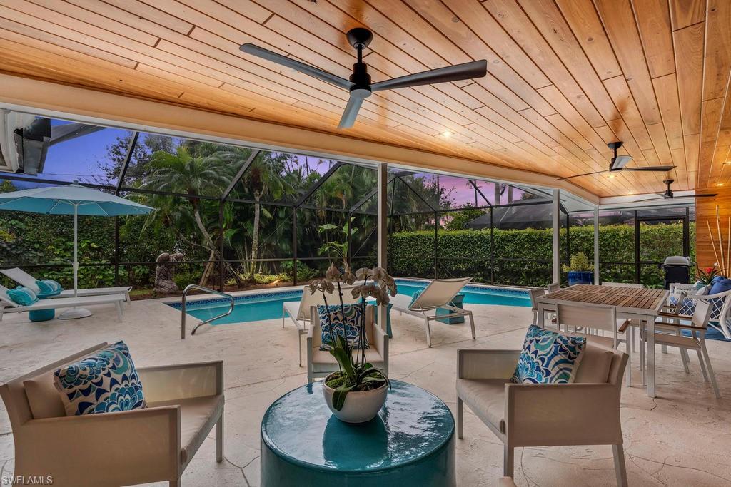 Updated a & beautifully decorated home with desirable Southern exposure just waiting for those who want to live like they are on vacation everyday! Stunning new kitchen, new impact glass SGD's & DR windows, pool, decking completely refurbished & cypress accent wall/ceilings added. Too many additional upgrades to mention. New paver driveway and extra wide walkway with front porch just completed. Must see this one to fully appreciate! GREAT OPPORTUNITY WEST OF 41! Walk to Waterside Shops, Publix and just over 1/2 mile to Clam Pass Beach. A short bike ride just over a mile to Venetian Village & the beach at Park Shore. This property is located in the "X" zone for easy addition(s) to home if so desired.