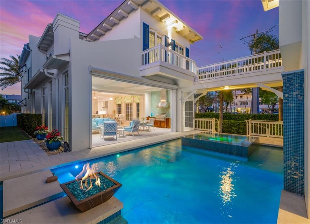 Nestled in the heart of beautiful Olde Naples, this exquisite single-family home epitomizes luxury living. Stunning and pristine classic coastal style home offering architectural beauty and sophistication. Enjoy sugar-sand beaches, famous Fifth Avenue, Cambier Park, Naples Bay, Dining & Shopping, all located a short distance away. This home has everything you could ask for with timeless style, and modern amenities. The open floor plan offers seamless transitions between the large kitchen, family room, and outdoor living spaces and is flooded with natural light beaming in from the ideal southern exposure and floor to ceiling windows. The chef inspired kitchen is perfect for culinary enthusiasts and offers Miele appliances, natural gas cooking with center island & custom cabinetry, quartz countertops and a hidden pantry. The interior also features Legno Bastone European wide plank flooring, automated window coverings throughout, and a private elevator. The luxury master suite is a heavenly retreat, and all bedrooms enjoy en-suite baths and a conveniently located upstairs laundry room. A highly desirable feature is the SEPARATE second floor cabana which can be utilized as your guest quarters, office, gym, or nanny suite and has two convenient separate entrances. The tropical private courtyard garden offers pool with color light show, spa, waterfall and fire bowl in the expansive outdoor living space complete with a pool bath and an outdoor kitchen, wine cooler and gas grill.  No detail was spared! Amenities include a 2-year-old Kohler generator, house completely repainted only 2-years ago, Hurricane resistant windows & doors, Elan g! automation system with surveillance, sound and lighting package, Andersen windows and a 2-car garage. Concrete block construction and standing seam metal roof with custom color for durability and energy efficiency.  For The Most Discerning Buyer!