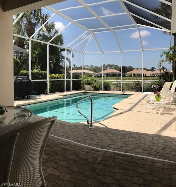 Don't look any further for a home where you can relax on the extended lanai and swim in the pool, while taking in magnificent sunsets of SW Florida. This Villa is located on hole #3, of Vanderbilt Country Club, where the cart path is located on the opposite side of the fairway, away from the home. Your guests will be impressed when they're greeted at your beautiful lead glass door.  42" kitchen cabinets with slide shelves set the kitchen apart from the rest. There is plenty of space to seat guests in the kitchen's extended space, and additional room in the more formal dining area. Don't put off having your own golf cart any longer. The garage has plenty of space for two cars, a golf cart and has ample shelves for storage. If spending time outside is your thing, you'll appreciate the extended lanai area. The heated pool comes with a new motor. Many of the rooms have 8 foot doors; crown molding frames the living room, master bedroom, and den. The hot water heater was replaced two years ago. You don't want to miss seeing ALL of the special features this home offers.