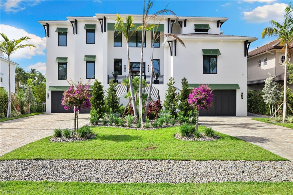 The home you have been waiting for is here! Welcome to your dream home in the prestigious resort-style Conners at Vanderbilt Beach community. This stunning custom-built, move in ready,  turnkey, single-family home, built in 2024 and located at the end of a cul-de-sac, boasts 5 bedrooms, 7 baths, and a spacious 4 car garage with ample storage. All bathroom windows have frost feature for added privacy. Relax, unwind, entertain on one of your expansive outdoor living areas or play by poolside in your private pool and spa that overlooks the sparkling waterfront.Your outdoor kitchen features a BBQ grill, smoker, deep fryer, pizza oven, griddle, refrigerator, and ice maker. Bring your boat and jet skis! Your private dock gives you the convenience of quick access to the gulf and fun water activities. From the moment you enter into your grand 2 story foyer; you will see what luxury affords. The interior welcomes you with wide plank white oak engineered hardwood flooring throughout, and features luxury furnishings, high-end finishes and lighting, private elevator, main floor primary bedroom with en suite, second floor primary bedroom with en suite, two separate family/ living rooms (one on main level and one on the second floor), open dining area, sound system, and first and second floor laundry rooms. The open concept kitchen offers timelessly elegant quartz countertops, premium appliances (including a built-in gourmet coffee maker) and an oversized pantry. Located near Vanderbilt Beach, La Playa Beach and Golf Resort, The Ritz Carlton, Delnor-Wiggins State Park, Mercato and Waterside shoppes. Come live the life of luxury you deserve at Conners at Vanderbilt Beach.
