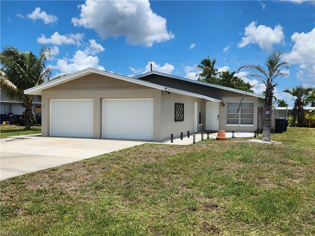 Location, Location, Location --- Just minutes from Ft Myer's Beach and not far from Sanibel, this duplex offers a prime location along wuth a great income.  Each unit has two bedrooms, 1 bath, garage, and screened lanai.  The inside laundry includes a washer and dryer.  Other appliances included are refrigerator, stove, dishwasher and microwave.  The duplex is updated with vinyl plank flooring throughout.  Both garages have auto garage door openers and provide lots of extra storage space.  The roof was new in 2023 and the duplex has been freshly painted.  This is a great property for the owner/investor who wants to live near the beach and have some extra income or the investor, as this is a high demand area.  One unit is currently rented annually ($18,480) with good paying tenants.  The other unit is move-in ready for you or your next tenant.  With a second tenant, you can add another $18,000 annually to the income.   This convenient location is close to stores, restauants, schools and the BEACHES!  Schedule your private showing today.
