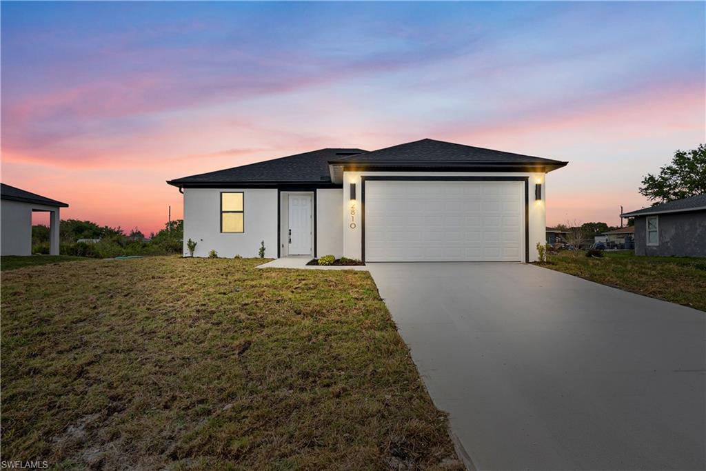 Move-in ready new construction, priced to sell and designed for the way you actually live. This beautifully built home offers a spacious and functional layout with excellent separation between the living areas and bedrooms, providing both comfort and privacy. From the moment you walk in, you'll notice the open feel, abundant natural light, and modern finishes that make the space feel like home.

The kitchen features a large center island that flows seamlessly into the spacious living area, creating the perfect setup for everyday living and entertaining. The privately positioned primary suite is tucked away from the secondary bedrooms and includes dual sinks for added convenience. A full two-car garage provides plenty of room for vehicles, storage, or hobbies.

Conveniently located near Sunshine Blvd N with quick access to shopping, dining, schools, and major roadways, this home offers exceptional value in one of Lehigh Acres' fastest-growing areas. Don't miss your opportunity to make it yours.

*Photos are from a similar completed model. Floor tile, bathroom shower tile (white in the subject property), and certain finishes, colors, fixtures, and design selections may vary from those shown.*