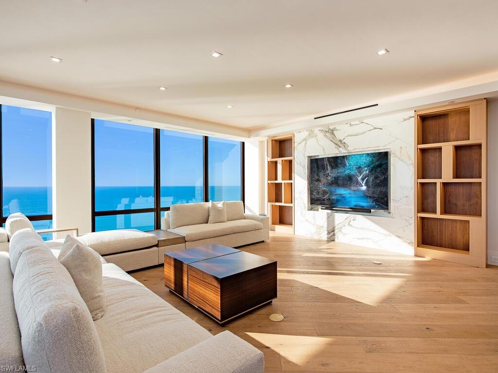 Welcome to coastal living at its finest.  Unlike a spec home, the owners spared no expense, on this impressive custom property. This fully renovated penthouse residence, with Prime Southern Exposure, offers a rare opportunity to own a home where everything is brand new. Sun drenched with over 1000 sq.ft of outdoor space, two separate lanais,  you will enjoy stunning Panoramic views of the beach and Venetian Village . Thoughtfully redesigned from top to bottom, the interior features large foyer with wine room, wide-plank wood flooring throughout, custom wood ceilings, and a bright, open layout ideal for relaxed coastal living. 

Highly desirable South and Western exposures ensures Abundant Natural Light thoughout the home.

The chef’s kitchen showcases stunning quartzite countertops, new cabinetry, and beautiful finishes that blend elegance with functionality. The expansive fixed wall of glass in the kitchen gives you the feeling you are outside. There is a separate catering pantry. 

 Private owners suite with separate office , large owners bath/suite with custom walnut cabinets, and 2 walk in closets both with custom walnut cabinetry. The  V.I.P. Suite has very long beachfront views and a private entrance to the lanai. Total of 5 bedrooms all ensuite.

The living space flows seamlessly to the outdoors through new impact-resistant sliding glass doors, providing peace of mind while maximizing natural light and Gulf breezes.  A garden in the sky, there’s a unique Living Wall on the private lanai that connects the guest suites. 

Offered fully decorator furnished, completed furnishings arriving by the end of January, this residence is move-in ready — perfect as a primary home, seasonal retreat, or investment property. Located directly on prestigious Gulf Shore Boulevard North, you’re just steps from the beach and minutes to Naples’ world-class dining, shopping, and dining. 

Enjoy peace of mind and convenience with THREE dedicated enclosed garage parking spaces, on the second level , a rare find along Gulf Shore Boulevard. 

Le Parc provides 24-hour security, an on-site manager, and exceptional resort-style amenities including a Har-Tru tennis court, fitness center, men’s and women’s saunas, heated beachfront pool with Gulf views, and a 1.25-mile private beachfront promenade. Additional amenities include a card and game room, billiards, ping pong, and a social room with catering kitchen, perfect for entertaining and sunset gatherings.