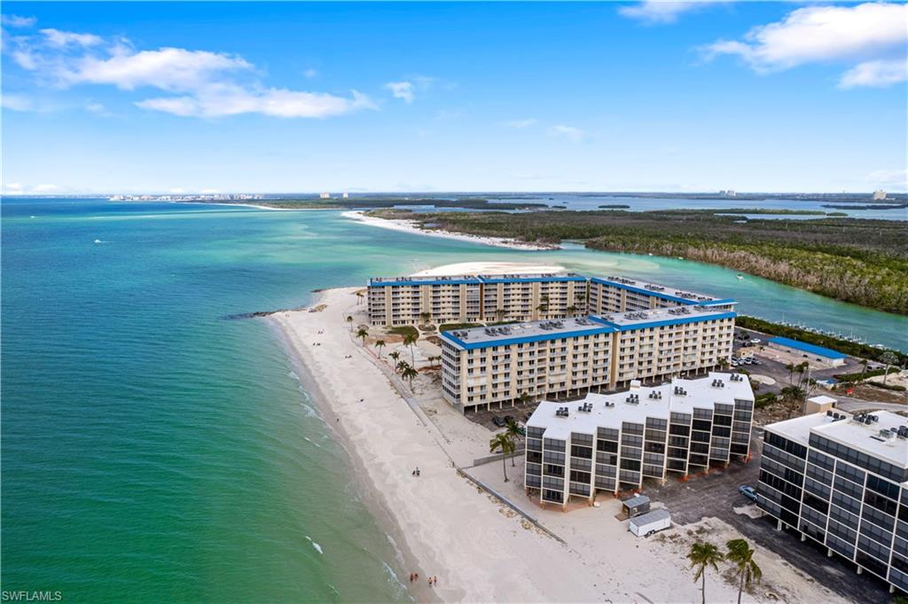 C14150  Beachfront END-UNIT with spectacular Gulf & Bay views! This unit has formal occupancy approval! Currently the lowest-priced beachfront condo available on Bonita Beach! Enjoy endless Western beach views allowing for breathtaking sunsets from your Gulf-front condo. This coastal retreat offers hurricane impact windows/sliders, electric storm shutters & screened-in balcony. This light & bright condo is immaculately maintained & features an open floorplan with tile floors throughout. The neutral kitchen offers light cabinetry, quartz countertops & beautiful views of the bay. Great future rental potential or vacation beach condo. Also includes a covered parking space! The Seascape community has engaged the services of an architect & design specialist to revitalize their stunning grounds and resort-style amenities. Seascape is perfectly located on the tranquil North end of Bonita Beach with a beachside pool, grilling area, fishing pier, community room, shuffleboard, tennis courts, on-site management & Gulf-access boat slips for purchase when available. Seascape elevators & amenities are in the process of being restored.