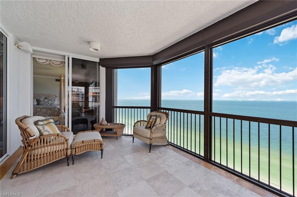 Gorgeous Gulf and beach views. Rarely available, higher-floor corner unit directly on the beach in the private gated community of Bay Colony in Pelican Bay. Featuring panoramic views of the Gulf of Mexico through floor-to-ceiling sliding glass, this highly sought-after floor plan welcomes you into an elegant entry foyer with a spacious living and separate dining area. Open kitchen and den offer plenty of room for entertaining family and guests, along with three full bedrooms, all with en-suite baths. The Biltmore amenities include a gorgeous, newer designer-renovated lobby with a 24-hour manned front desk, two guest suites, fitness center, social rooms and a resort-style pool. Bay Colony residents enjoy the use of their own private, newly renovated beach club and restaurant, a tennis club, as well as the use of the amenities of Pelican Bay. Private golf memberships are available separately.