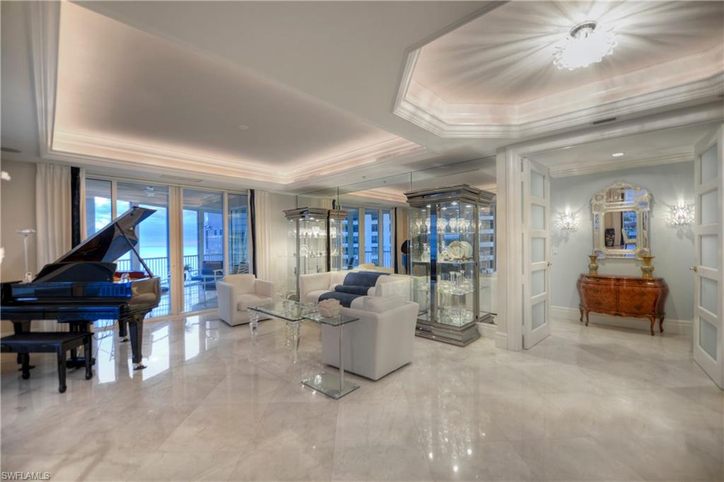 Sweeping breathtaking Gulf, bay and city views make this Park Shore 901 condo in the Aria a desired residence. Spread over a convenient 4,096 square foot floor plan, there are 3 bedrooms plus a den and 3.5 bathrooms, making this an ideal residence for luxury living. Upgrades are new and numerous, and include many of today's most sought-after features: marble flooring in the main living areas, a large modern chef's kitchen with upgraded appliances, granite countertops, center island, a 5 burner gas cooktop, a master suite with granite countertops in the bathroom and custom fixtures and large shower area; a den with wood flooring and a limestone fireplace that doubles into the family room; custom wall accents and ceiling lighting details; all main living areas and bedrooms have access to three private terraces for gulf watching and sunset views; electric hurricane shutters, storage unit; and much more. Aria includes lobby security, on-site manager, guest suites, fitness center, two social rooms, and a private oversized pool with a large deck and spa, boat slips available for lease or purchase, and more!