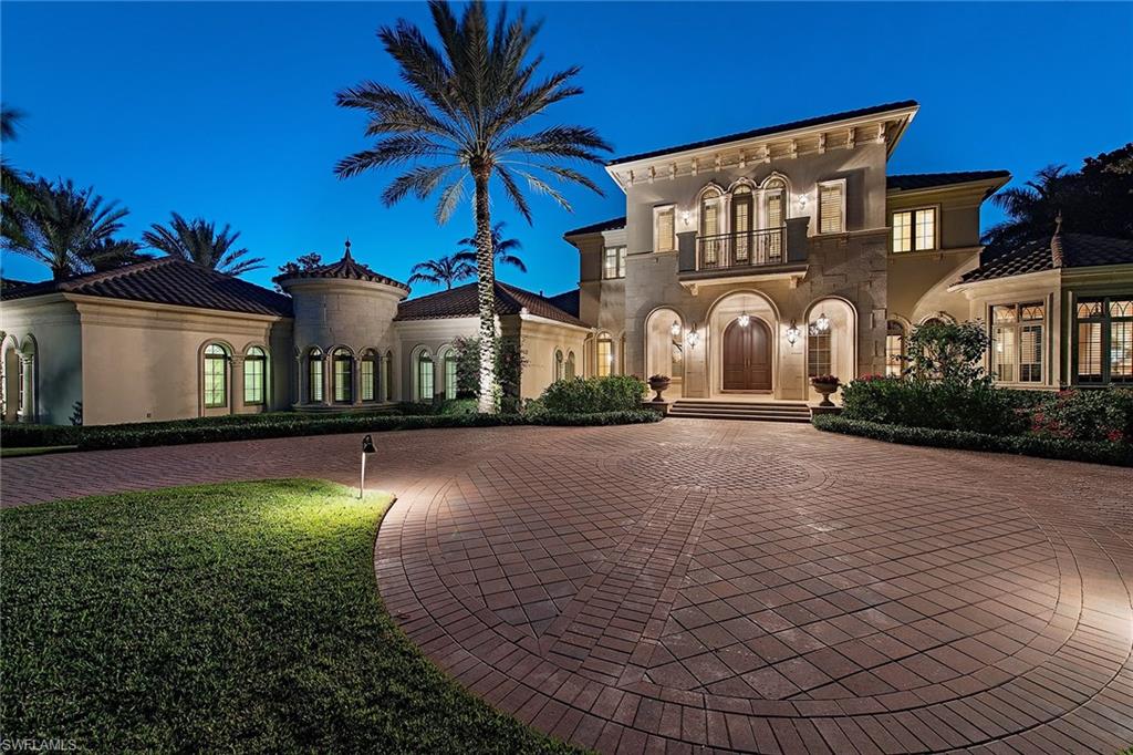 This extraordinary former estate model is located on a serene, private 0.75-acre homesite overlooking a glistening lake and lush golf course beyond. The classic exterior design includes extensive precast stone, private motor court and an opulent classical garden with fountain. The five-bedroom, six-and-one-half-bath home includes a dramatic soaring two-story foyer, elegant ceiling detail throughout and neutral marble flooring. Designed for entertaining, the outdoor living space features a covered loggia with stone fireplace, summer kitchen with bar and an infinity-edge pool and spa. Additional features include a luxurious master suite with dual baths, state-of-the-art media room, whole-home generator, climate-controlled wine cellar, gourmet-equipped kitchen with butler's pantry and a full cabana guest suite. Located just minutes from world-class dining, shopping and beaches of Old Naples, the award-winning Grey Oaks Country Club has recently completed a multi-million dollar renovation, including an incredible new lagoon beach-entry pool, fire pits, indoor and outdoor restaurant and bar, tennis center, golf facility and a lavish 30,000-square-foot health and wellness center.
