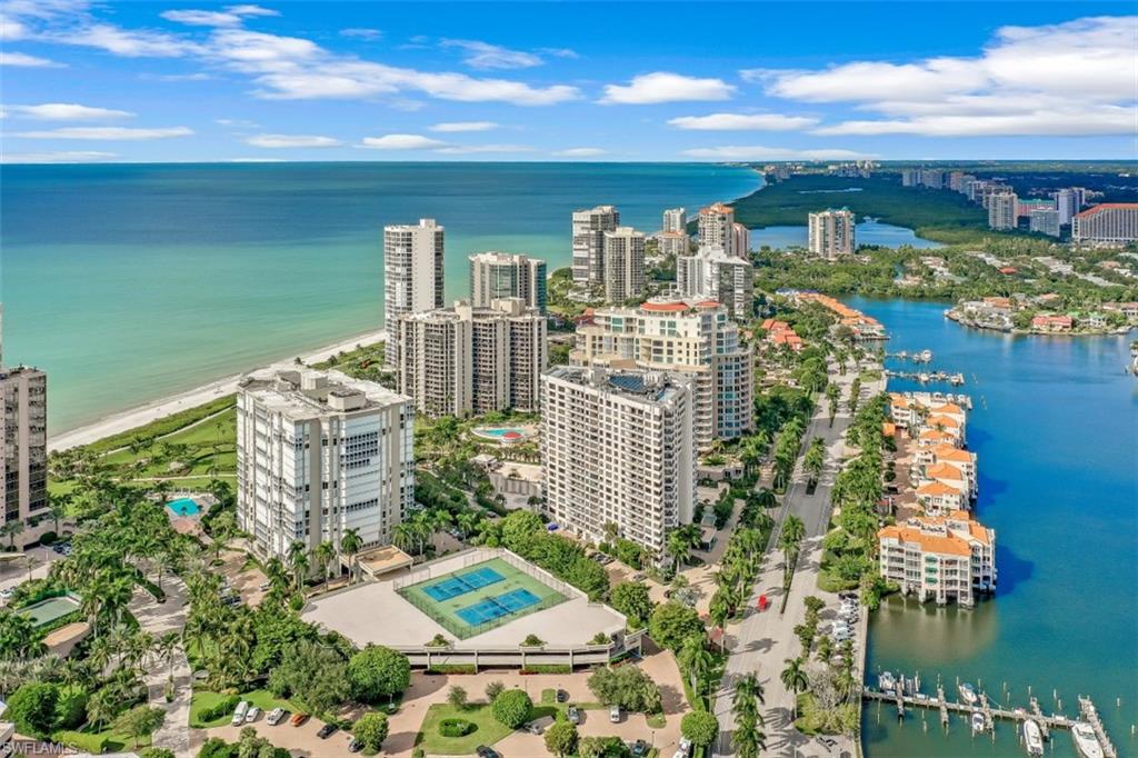 C3915 - A magnificent, re-mastered 11th floor, Park Shore beachfront condo, w/SW views of the Gulf. Spacious, bright & flowing floor plan exudes the Florida lifestyle. Designer floor tile throughout, new LED lighting, F-to-C windows w/RC roller shades. The new kitchen features Thermador appliances w/induction cooktop, microwave, speed-cook oven, warming drawer, column refrigerator/freezer, dishwasher & all new cabinetry w/solid surface quartz countertops. The adjacent wet bar offers a dual-zone wine cooler, refrigerated drawer & freezer drawer w/icemaker.  All bedrooms are ensuites, each featuring their own screened-in lanai, gulf-water view, ample closet space, privacy & custom bathroom back-lit mirrors. The 3rd bedroom could double as an office or craft room. A Honeywell dehumidification system, Kinetico water softening system w/RO drinking water & ice are great additions. The unit boasts extra storage & 2 deeded covered parking spaces. The Monaco Beach Club provides concierge services, many amenities & offers its owners & their guests a professional & proactive management team & staff. Enjoy a short stroll to the Venetian Village dining, shopping & entertainment.