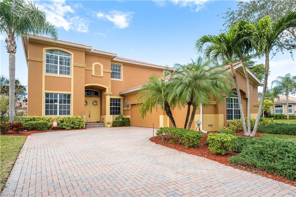 This exquisite 4 bedroom + den,4 bath,3 car garage estate home is located in the gated community of Colonial Shores!Just minutes to the sugar sand white beaches of Sanibel,Captiva,Ft. Myers & Bunche Beaches!This 2 story home sits on a large corner lot with more than enough room for a pool!As you enter this masterpiece,you will be enveloped in the 22' ceiling w/an Italian chandelier,walls of glass for lots of natural light,8 ft. sliders,formal dining.Relax on either of your 2 screened in lanais,1 off of the master suite,other off of family rooms & enjoy the fabulous lake views,wildlife & sunsets!Concrete Block Construction on both levels!Plank tile flooring on first level.Newer upgraded carpet throughout 2nd level.Office/den & full bath w/walk in shower located on 1st level.Master suite & 3 nicely sized bedrooms are on 2nd level.Master suite has tray ceilings,uplighting,ensuite bath w/dual granite vanities,walk in closet.Open concept is perfect for entertaining large groups/families!Kitchen boast dark cherrywood 42"cabinets,granite countertops,island,walkin pantry.Hurricane protection.Home is adorned w/many upgrades-crown molding,plant.shutters,pavered driveway,central vac.LOW HOA!