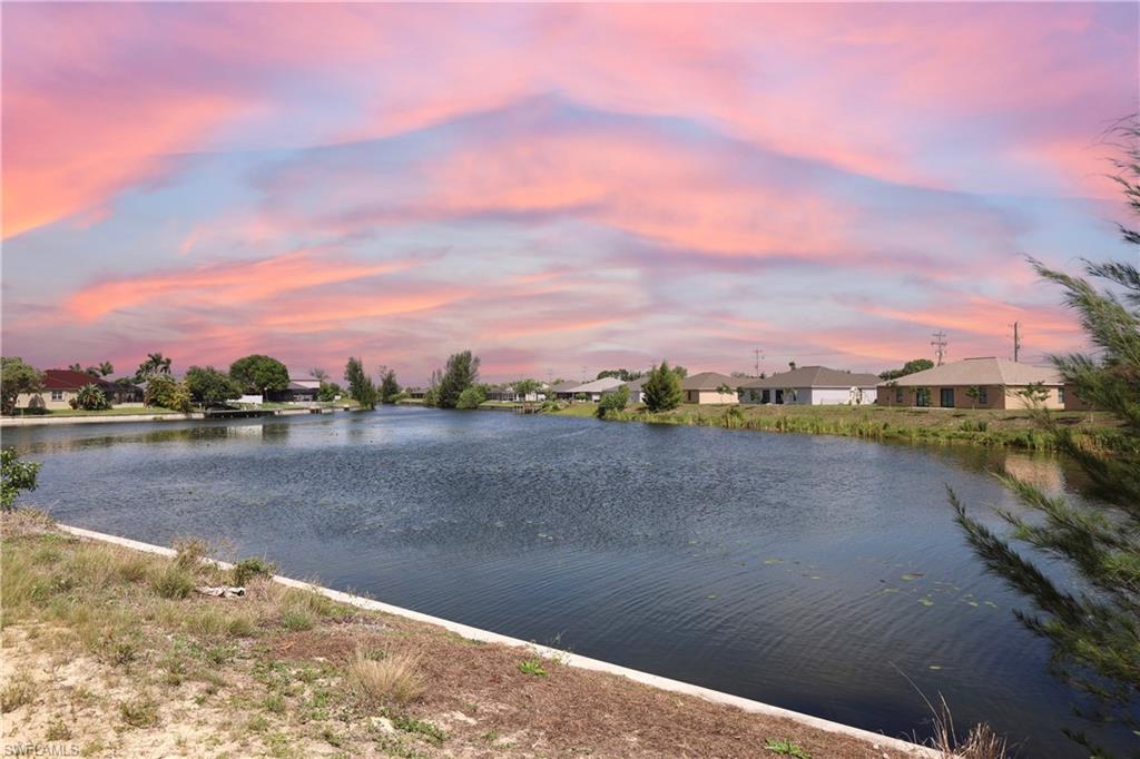 Prime waterfront opportunity in the heart of Cape Coral, ideally situated on the navigable Barkentine Canal in highly desirable SW Cape Coral. This exceptional lot offers stunning sunset views and direct access for fishing, kayaking, and boating right from your backyard.

Featuring an extended 97’ seawall, the property showcases expansive, unobstructed views of intersecting canals, enhancing both value and lifestyle appeal. Located close to shopping, dining, schools, medical facilities, and golf courses, it combines convenience with waterfront living.

City water is in place and the property is NOT in a FLOOD ZONE, making it fully ready for your dream build. A rare opportunity to secure a premium homesite in a sought-after location.