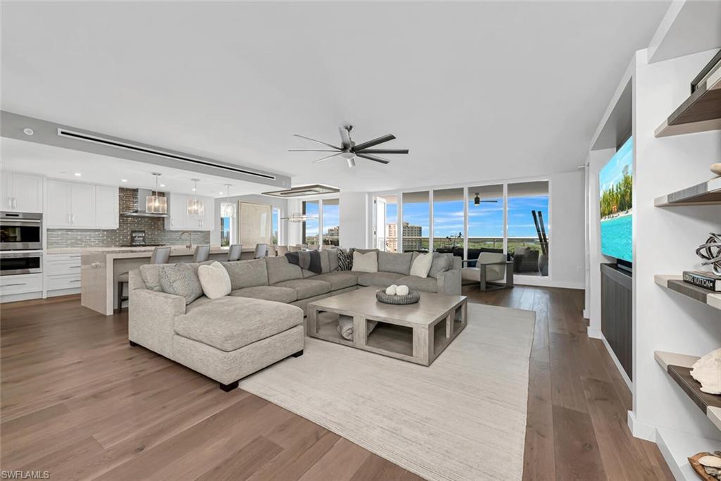 Live the serenity and understated elegance of Kalea Bay: a Naples 5-star, luxury-designed, pet-friendly waterfront resort community. Opportunity awaits with this rare 7th-floor end unit offering endless unobstructed Gulf, marina and Intracoastal views. Turnkey furnished from Clive Daniel and Robb & Stucky, available for occupancy this season. Private elevator foyer reveals a great room with a waterfall quartz island and an open kitchen leading to a generous butler's pantry. The open and elegant floor plan spaciously flows from room to room, featuring floor-to-ceiling, impact-resistant glass windows and doors that open to a 21-foot open-air sunset terrace with glass railings, plus a second sunrise terrace. Custom upgrade and interior design package include Wolf and Sub-Zero appliances, wine bar, natural gas, Legno Bastone wood floors, custom built-in cabinetry and closets, quartz countertops, generous laundry room, plus under building garage spaces. Experience the superb tower rooftop pool and sky lounge, 3 club pools, indoor/outdoor bistro, restaurant and bar, state-of-the-art fitness centers, tennis/pickleball, 12 guest suites and optional Moraya Bay private beach card membership.
