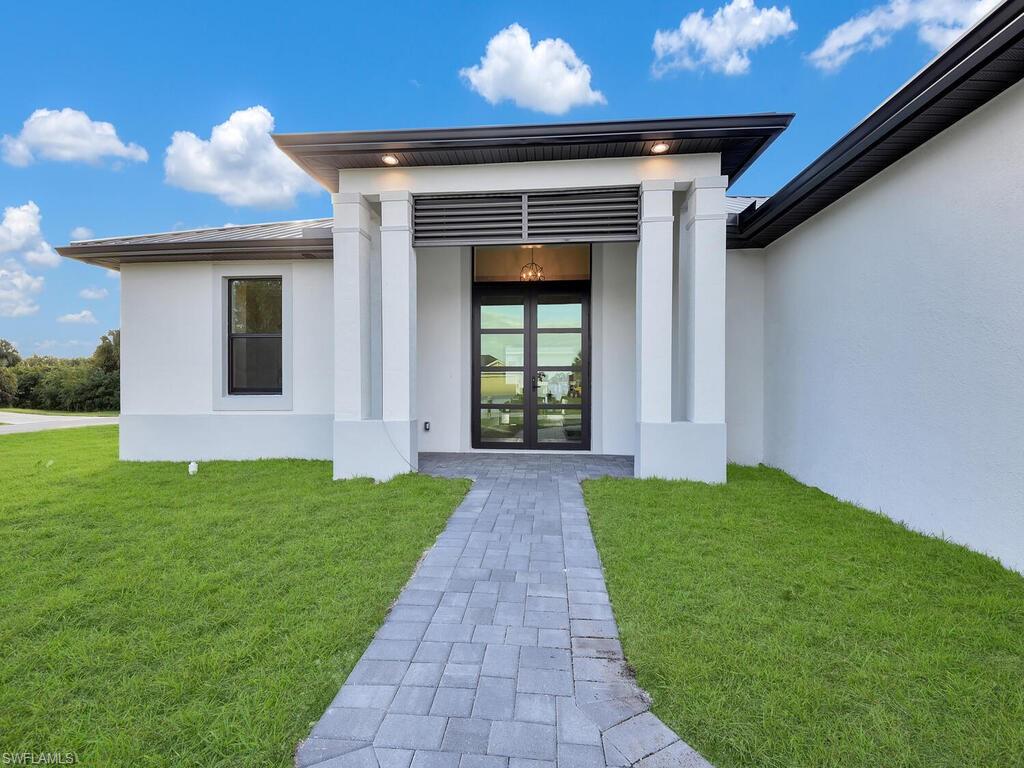 NEW CONSTRUCTION SINGLE FAMILY HOME ON A LARGE LOT WITH NO ASSOCIATION DUES! It has an anticipated completion date of February 2022. This home comes standard with a metal roof and impact windows & doors! Gorgeous contemporary layout w/ open concept kitchen, center island, quartz countertops, stainless steel appliances, split bedroom floor plan, luxury plank tile flooring throughout, contemporary double door front entry, large slider system in the rear of the home, laundry room w/ washer dryer hookups, multiple sets of tray ceilings, crown molding, walk-in closet, frameless shower door in master bath & huge shower niche with mosaic glass tile, paver driveway, walkway and patio with a 2-car garage. You will love this amazing home with top quality construction with a builder warranty! The pictures are the same exact model on another location that has already been sold. The colors and materials are the same. There are no changes or additions as this home is already underway with permitting and materials.