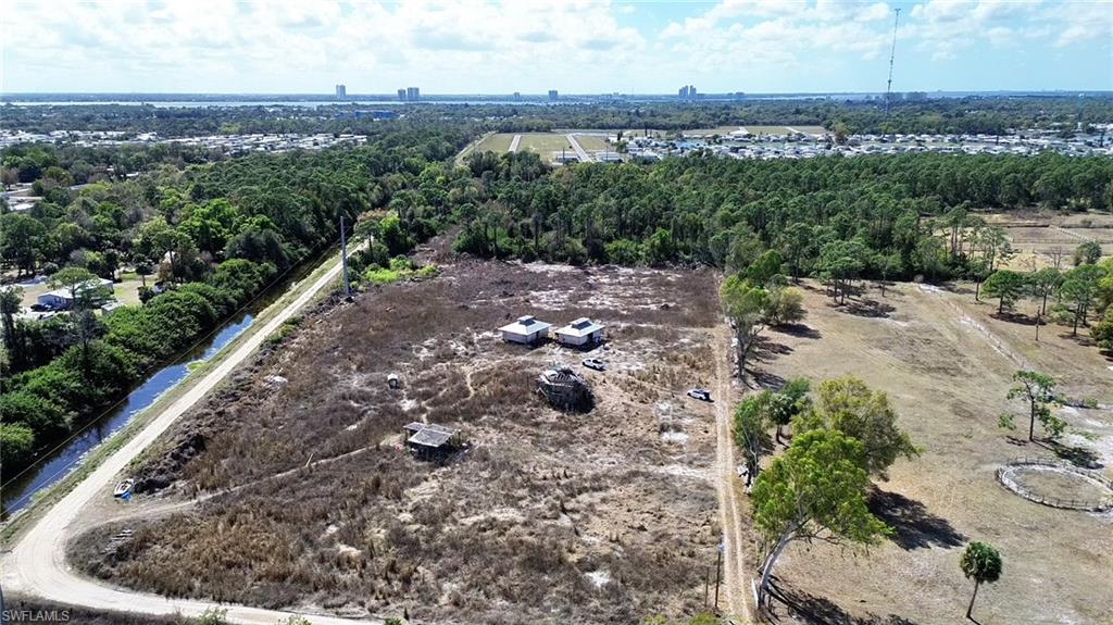 Opportunity awaits in the rapidly growing community of North Fort Myers. This unique offering includes two adjoining parcels being sold together, totaling 15.618± acres, presenting a rare opportunity to secure a large tract of land in one of Southwest Florida’s steadily expanding corridors. The combined sales price reflects the market value of both parcels, offering exceptional potential for a private estate, equestrian retreat, future development, or long-term investment.
Positioned with desirable western exposure, the property provides the perfect setting to enjoy Southwest Florida’s spectacular evening skies and vibrant sunset views. The natural orientation of the land allows future owners to fully appreciate the region’s beauty while creating a peaceful and private setting.
With over fifteen acres of open space, the property also presents an outstanding opportunity to establish a private equestrian oasis. The expansive acreage provides ample room for stables, paddocks, riding arenas, and scenic riding trails, allowing buyers to design a personalized equestrian estate while enjoying the privacy and flexibility that larger parcels provide.
Located just minutes from the scenic Caloosahatchee River, the property benefits from the natural beauty and recreational lifestyle that defines Southwest Florida. The nearby riverfront offers boating, fishing, waterfront dining, and access to the region’s extensive waterways, including canal systems that lead toward the Gulf of Mexico—an appealing feature for boating enthusiasts.
North Fort Myers continues to attract homeowners, developers, and investors thanks to its blend of natural surroundings and expanding infrastructure. Convenient access across the Caloosahatchee River places downtown Fort Myers just a short drive away, offering dining, shopping, entertainment, and cultural attractions. Major roadways nearby provide easy connectivity throughout Lee County and the greater Southwest Florida region.
Surrounded by an area experiencing steady residential growth and new construction, this property offers a rare combination of acreage, privacy, and proximity to everyday conveniences, marinas, and outdoor recreation. Parcels 26-43-24-00-00028.022A and 26-43-24-00-00030.0000 are offered together as one package, delivering exceptional space and opportunity in a location where large acreage properties are becoming increasingly rare.