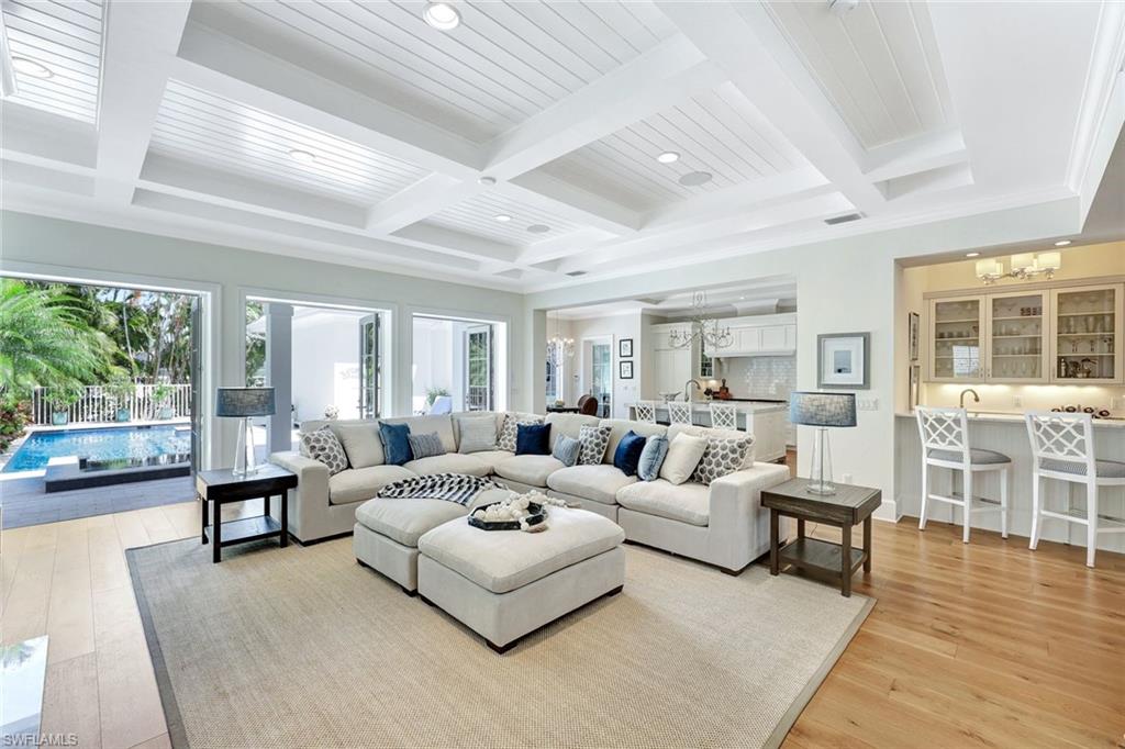 According to buyers; this home is gorgeous and should sell soon.  4+Den, Tall 3 Car Garage, Elevator in home, owner suite first floor, wide interior living space, high impact glass, two large walk-in closets in owner suite.  Coveted location two blocks from iconic Third Street South, a few blocks to the marina and less than five blocks to beach.  Car enthusiasts will see this massive 3 car garage at rear with soaring high ceilings and recognize potential to add a lift.  The advantage of this lot is that the home's interior remained safe and dry in storms. Elevation 8.1 feet. Seller disclosures are available upon inquiry.  Home has an impressive automated leak detection system,  Perhaps even more desirable than a dual master suite is this home's elevator, 3 large guest suites upstairs with large walk-in closets and ensuite bathrooms, along with a picturesque large upper balcony looking out to the large patio, pool and spa.  Metal roof, 4 bedrooms plus Den.  Gorgeous pool, spa and covered patio outdoor living space with outdoor kitchen.

Third Street South is the exquisite, renown gem of Olde Naples. Transport yourself back in time to a vibrant and chic island type aura with a splendid culinary scene, casual and elegant dining, courtyards, shops, neighborhood events such as farmer’s markets and holiday cheer. Modern open floorplan with a timeless design. Timeless and welcoming curb appeal, dramatic and lushly presented palm trees adorn the large front yard.  Larger lot, a quarter acre.  An abundance of natural light compliments the wow-factor great room plan.  Beautiful wood flooring, Carrera marble tops, a highly functional kitchen fit for a chef.  Owner suite and enclosed den by foyer are on ground floor. Pool, spa with large covered outdoor living area with outdoor fireplace, tv area and outdoor kitchen, patio bathroom. This breathtaking home epitomizes the renowned Olde Naples lifestyle as it enjoys such close proximity to the lifestyle that awaits you at Third St. South and Fifth Avenue.  Close proximity for your boat at the marina, and the Naples Yacht Club.