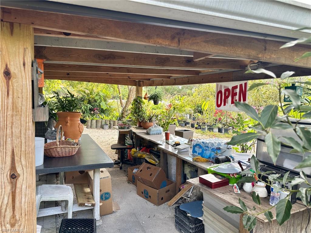 A rare turnkey opportunity: An established Buckingham Gardens and Nursery business on a large residential approximately 1.178834 acre corner lot on Buckingham Road, Westwood Acres. This property blends a licensed nursery operation with convenient residential amenities, all in one parcel. Features a customer stand, a wood-frame-built Tiny Home/Office and storage. It also features a fenced nursery operation with a cattle-gated entrance for owner and visitor parking/loading, plus a large, roofed sales stand and expansive inventory of potted ornamentals, shrubs, palms, flowering trees, ceramics, and related garden decor. NOTE: available are nine fruit filled Mango trees and two with fruit-filled Avocado trees. Included on the grounds is a wood frame equipped “tiny house” (mock kitchen, shower, toilet, bedding) with sheltered outdoor dining, surrounded by wooded screened trellis canopies, seedling beds, and potting starter work area benches. The fenced/gated private back area offers coops and space for seedling starters or hydroponics. A resident cat adds character to the property. This is a turnkey opportunity for buyers seeking an established nursery with flexible expansion opportunities and room to expand into hydroponics, propagation, landscaping services, plant rentals, or classes/workshops, etc. Items that do not convey are "marked."