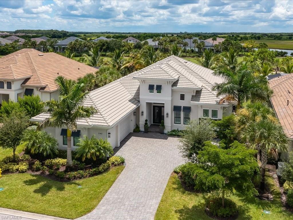 Marsh Cove Fiddler's Creek Homes - DON'T WAIT 4 years to start living the dream. Rare opportunity for purchaser of the magnificent home to have transferable MARRIOT golf/beach club membership immediately on home closing. This is Fiddler's Creek living at its finest. This favorite Madison II model from STOCK development places one in the lap of luxury with a wonderful golf course view of the Fiddler's ninth hole! The well-eqipped kitchen features quartz countertops, a center island, shaker-style cabinetry & professional-grade KitchenAid stainless steel appliances with gas for cooking. Numerous upgrades include a whole-home generator, plantation shutters & custom built-ins master closet, & second bedroom closet. The office is custom designed with room for two to work from home. The bedrooms each have their own private bathrooms. This is truly indoor/outdoor living. The outdoor space features a large covered patio area, pool, spa outdoor kitchen with BBQ sink & refrigerator. Also there is a bathroom that is accessible from the patio and pool area.Notable features includes,Storm smart hurricane see-thru shades,whole house Generac generator,front & rear outdoor lighting,& impact glass