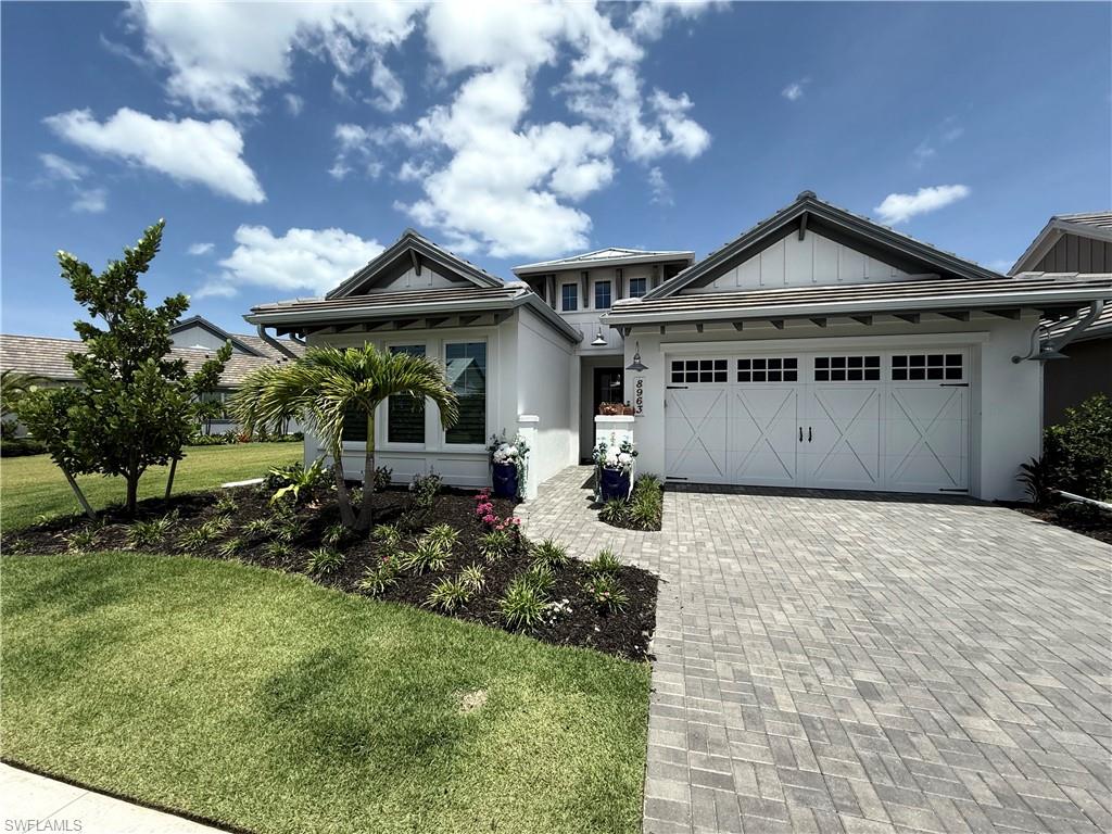 Welcome to your dream vacation! This luxury 4-bedroom, den, 3 ½ bath, pool & spa home is a coastal retreat that combines timeless elegance with modern comforts. It offers a seamless blend of designer finishes and sophisticated charm. Built for both relaxation and convenience, this home is in the award-winning community, The Isles of Collier Preserve, which is located just 4 miles from Downtown Fifth Avenue and 15 minutes to the beach. The community has a full-time Social Director creating daily activities, events and parties. It has a dog park and over eight miles of nature trails and kayaking on the Cypress Waterway to the Gulf of Mexico. There is a state-of-the-art fitness center and huge resort and lap pools. Bocce ball, pickle ball and tennis can be played before dining onsite at the Overlook Bar & Grill. The Isles of Collier Preserve is a luxury, ecofriendly community surrounded by nature. Property Highlights: • Coastal-inspired interior design: Thoughtfully curated by professional designer, featuring a palette of soft neutrals, organic textures, and breezy, beachy vibes. Equipped with stunning millwork, marble tiles and oversized porcelain tiles throughout the home. • Spacious and light-filled layout: Open-concept living spaces with soaring ceilings. The entire back of house opens up from floor to ceiling by pocketing sliding doors. This invites an abundance of natural light and seamless indoor-outdoor living. • Gourmet kitchen: Fully equipped with stainless steel appliances, quartz countertops, a large center island, and custom cabinetry. Perfect for entertaining or quiet family meals. • Custom furnishings in the family room to accommodate extra legroom for taller guests - no detail has been spared. • Elegant bedrooms: Four generously sized bedrooms, including a luxurious primary suite with a spa-like ensuite bathroom and custom walk-in closets. • Private Den: A versatile space ideal for a home office, library, or media room. • Designer finishes throughout: Custom tilework, statement light fixtures, and handpicked décor elements add warmth and sophistication. • Resort-style outdoor living: A custom outdoor kitchen with built in grill and fridge for indoor-outdoor living with spacious covered lanai perfect for alfresco dining, surrounded by private landscaping and an extra-large side lot; overlooks a beautiful private water and forest view. Additional Features: • Modern, energy-efficient home with smart-home technology. • Close proximity to beaches, shopping, dining, and club house and trails. • Flexible lease terms available for the discerning renter. This rare offering provides an unparalleled opportunity to enjoy luxury coastal living in a space that feels both refined and inviting because it was designed to elevate your lifestyle. Don’t miss out! Experience the lifestyle you’ve been dreaming of.