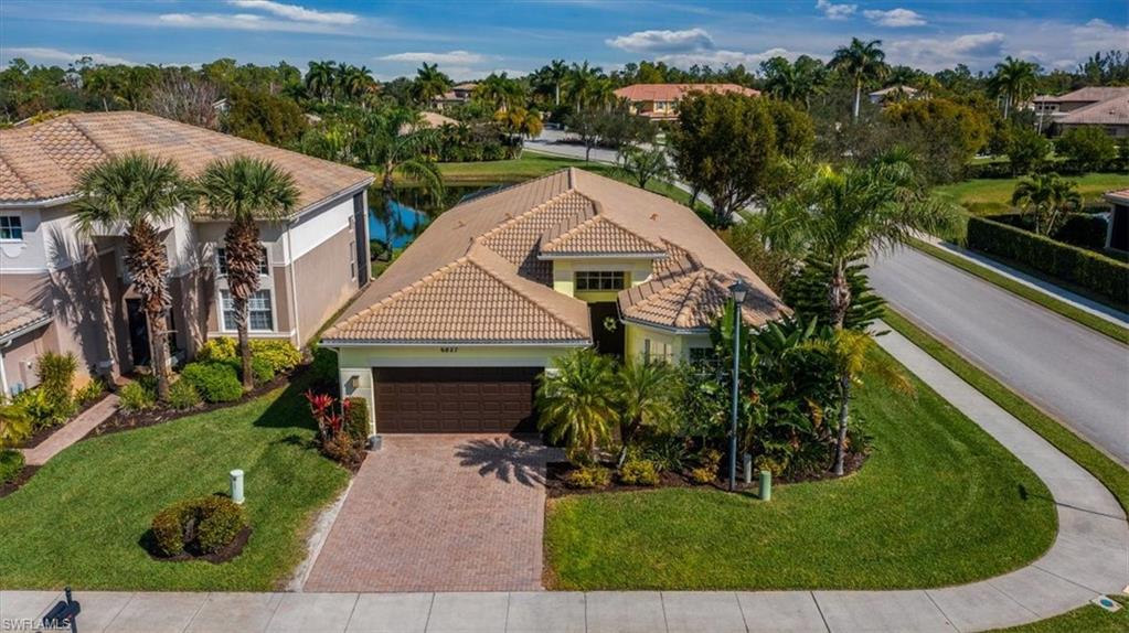 Boasting a beautifully renovated kitchen and master bath, this lakefront home is a great opportunity to join the popular Marbella Lakes community. The generous corner lot means the house is flooded with light at all times of day highlighting new coastal wood floors. There is a large center island in the kitchen and a sunny dining area for casual dining overlooking the pool and the lake. Formal dining room and living rooms beckon entertaining as does the screened lanai with ample pool deck and lakefront views. The generous master bedroom has direct access to the pool, large closets and an updated en suite master bath with separate tub and shower and dual sinks. There are two other bedrooms as well as a good size den that can readily serve as a 4th bedroom or play room. All of this is just a short stroll to the clubhouse with its beautiful resort-style pool, tennis, pickleball and indoor basketball court, gym and social area. There is even a children’s water park. This one will not last!