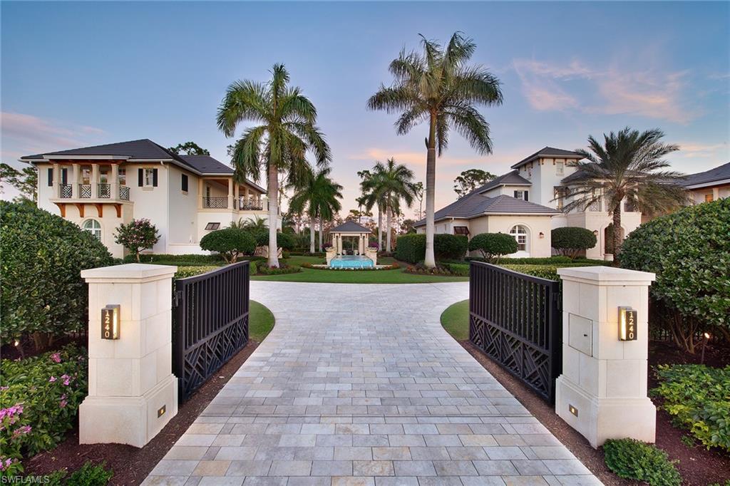 This custom-built masterpiece is now priced to sell and features a magnificent West Indies inspired main house, stand-alone guest house on a 1.29 acre homesite and has a full Grey Oaks golf membership available. The over 7,600 sq. ft. main house includes five bedrooms, a private apartment with full kitchen, sitting room & laundry, six full & two half baths and dual studies and owner’s baths. The 90-degree pocketing sliders open to a private lanai complete with automated screens & shutters overlooking a stunning long-range view of the Estuary golf course’s 8th fairway and private preserve beyond. In addition, a majestic linear fountain, sunken fire pit and covered sitting area seamlessly tie the main home together with an over 2,100 sq. ft. guest house perfect for visiting friends and family. Additional features include an automated entry gate, marble paver driveway, generator for each home and Savant home automation and media room.