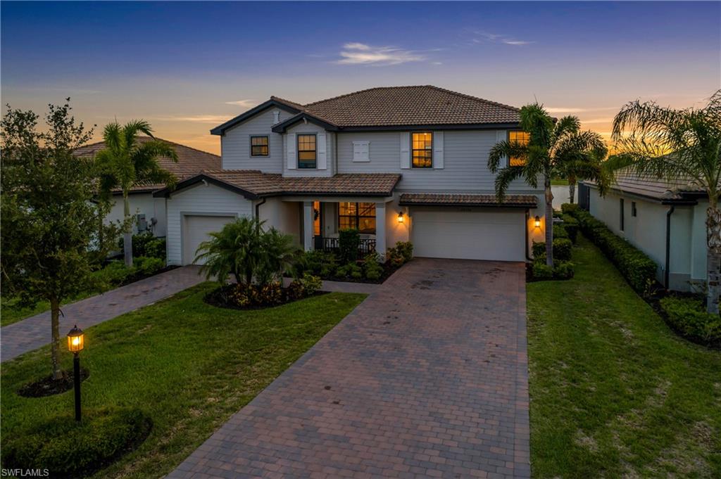 Welcome to 20100 Napa Loop, a large, lakefront residence in the sought-after Verdana Village community of Estero. The Sorrento floorplan by Lennar. This spacious 2-story home has 5 bedrooms, 4.5 bathrooms, a large loft area, and a split 3-car garage. 
One guest BR with an ensuite bath downstairs. Step outside to your private screened lanai featuring a heated pool and spa, creating the perfect setting for entertaining or relaxing while enjoying SW Florida’s stunning sunsets over the water. Inside, you’ll find an open-concept living area, high ceilings, kitchen with stainless steel appliances and a gas cooktop. Residents of Verdana Village enjoy a resort-style lifestyle with an expansive clubhouse, resort pool, fitness center, café, restaurant and lounge, indoor and outdoor pickleball courts, tennis courts, basketball courts, playground, and more. There is also a satellite pool on this side of the neighborhood to enjoy. At the gate entrance to Verdana is a Publix shopping plaza with an Italian restaurant, nail and hair salons, bank, dentist and more. Take your golf cart there. One or more photo(s) has been virtually staged, AI generated or rendered.