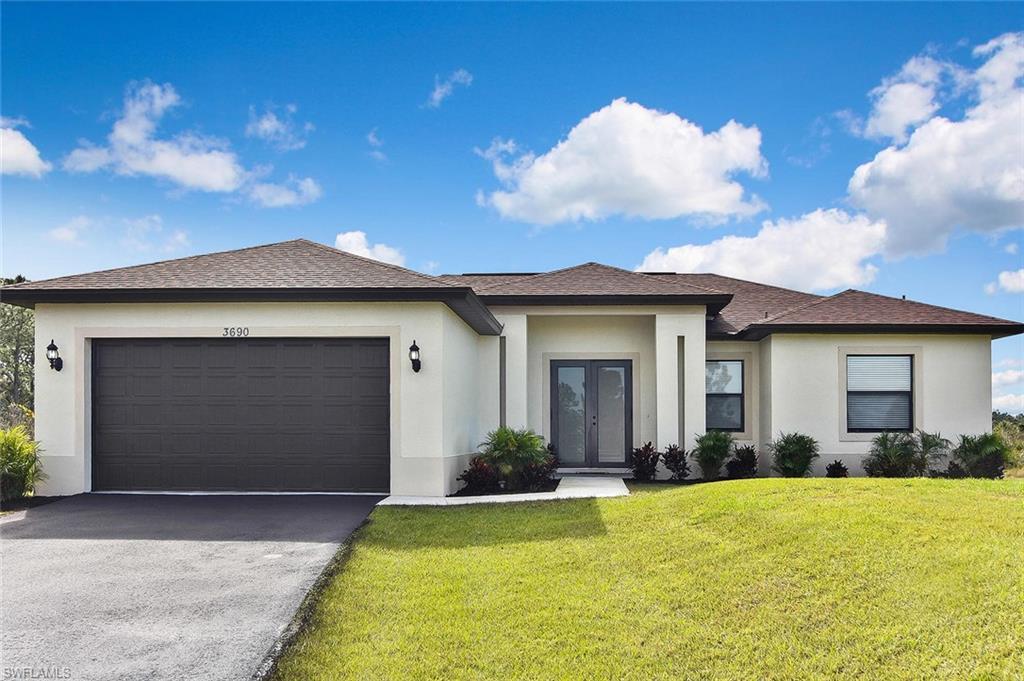 Move right in to this impressive newer home in Golden Gate Estates. Nestled on 2.73 acres, this home offers 3 bedrooms with a large owners suite with walk-closet, walk-in shower, open floor plan with living room, dining nook and kitchen connected for a spacious feel.  Light colors with 24x24 porcelain tile flooring throughout, tray ceilings, crown molding and eight foot interior doors add appealing detail.  Double entry doors both front and back. 2-car attached garage with epoxy flooring and storage shelving.  Open lanai with tile flooring and a desirable southern exposure overlooking a large grassy yard is ideal for a swimming pool or outbuilding.  Newer window blinds, light fixtures and ceiling fans throughout and a 1-year Home Warranty Provided!