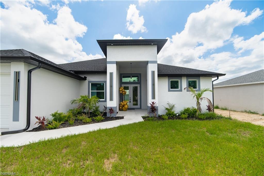 Experience modern elegance in this stunning new construction home located in the heart of Cape Coral. Boasting 2,201 square feet of thoughtfully designed living space, this exceptional residence offers 3 spacious bedrooms, 3 full bathrooms, a versatile den, and a 3-car garage.

The open-concept floor plan is filled with natural light and features soaring ceilings, hurricane-impact windows and sliders, and upscale finishes throughout. The chef-inspired kitchen showcases an oversized island, elegant cabinetry, and abundant space for entertaining. The expansive great room seamlessly connects to the oversized lanai, complete with outdoor kitchen hookups and ample room to create your dream pool and backyard retreat.

Additional highlights include a dedicated pool bath, elegant fixtures, energy-efficient construction, and a spacious layout designed for both comfort and style. Combining luxury, functionality, and timeless design, this remarkable home is the perfect place to live, entertain, and create lasting memories.